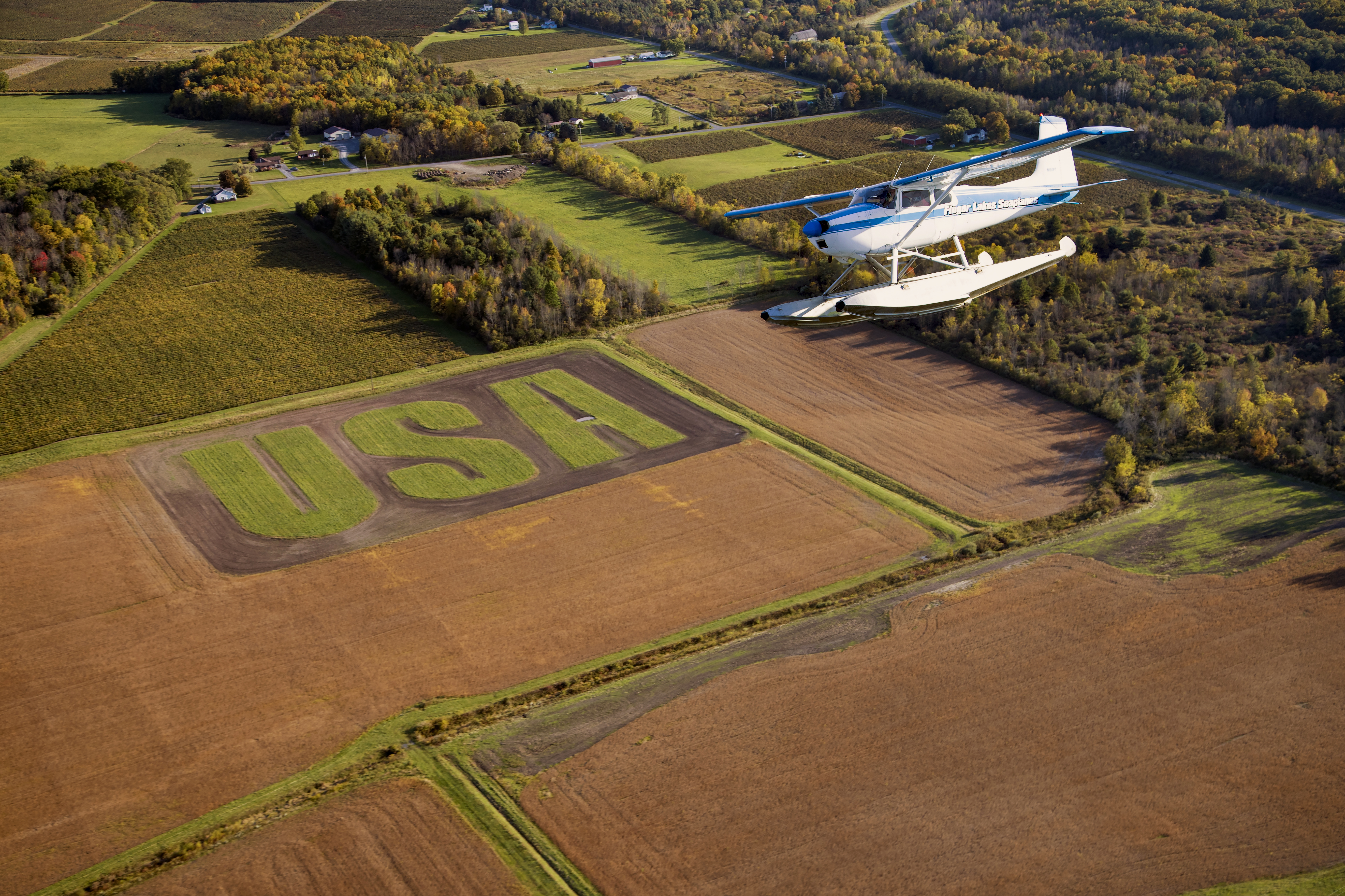 A flight over the Keuka Lake region offers spectacular views of vineyards and rolling farmland—and this patriotic message from a local farmer.