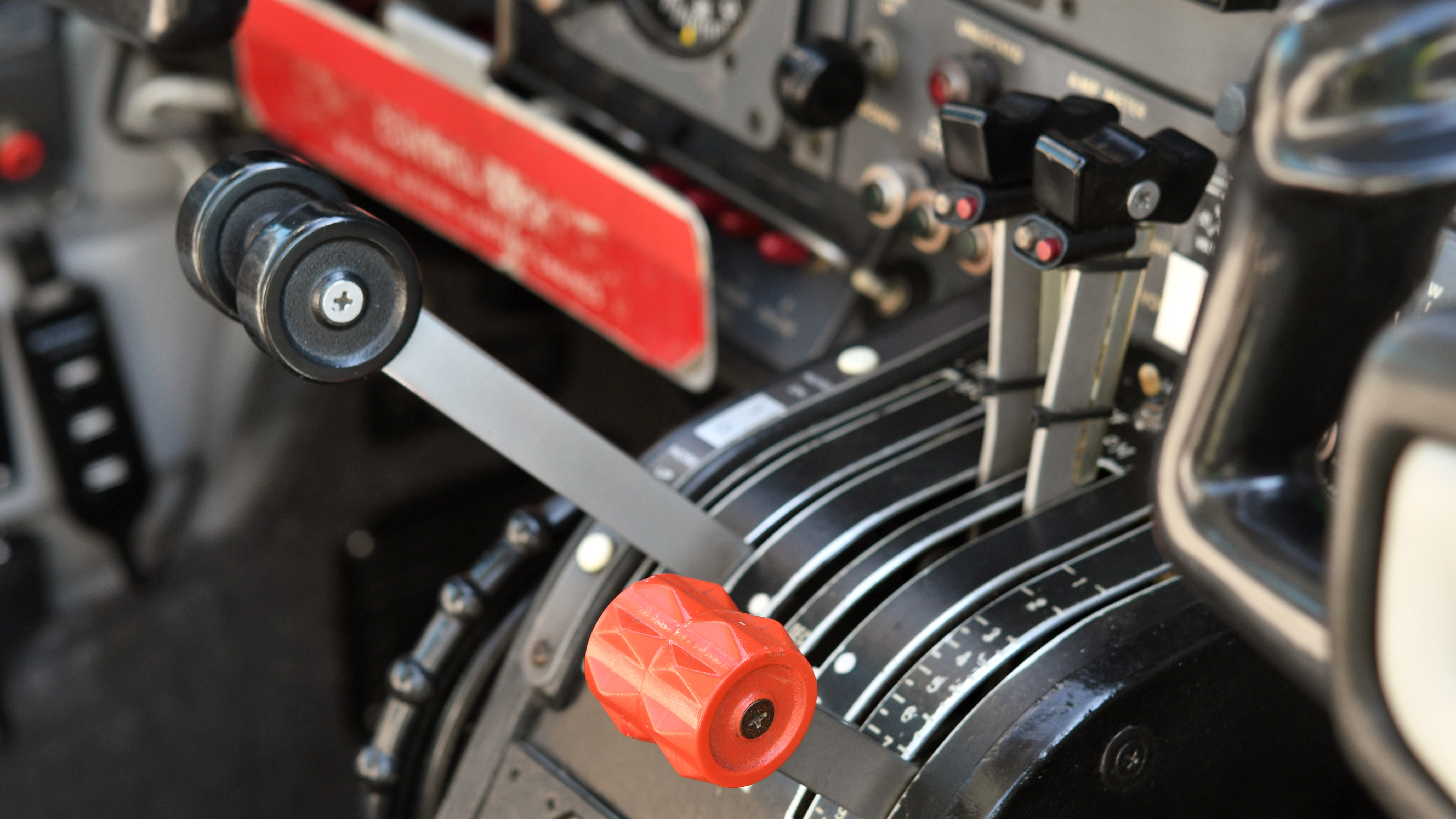 The throttle quadrant is standard, but annunciators for the low thrust detector system are mounted on the panel.