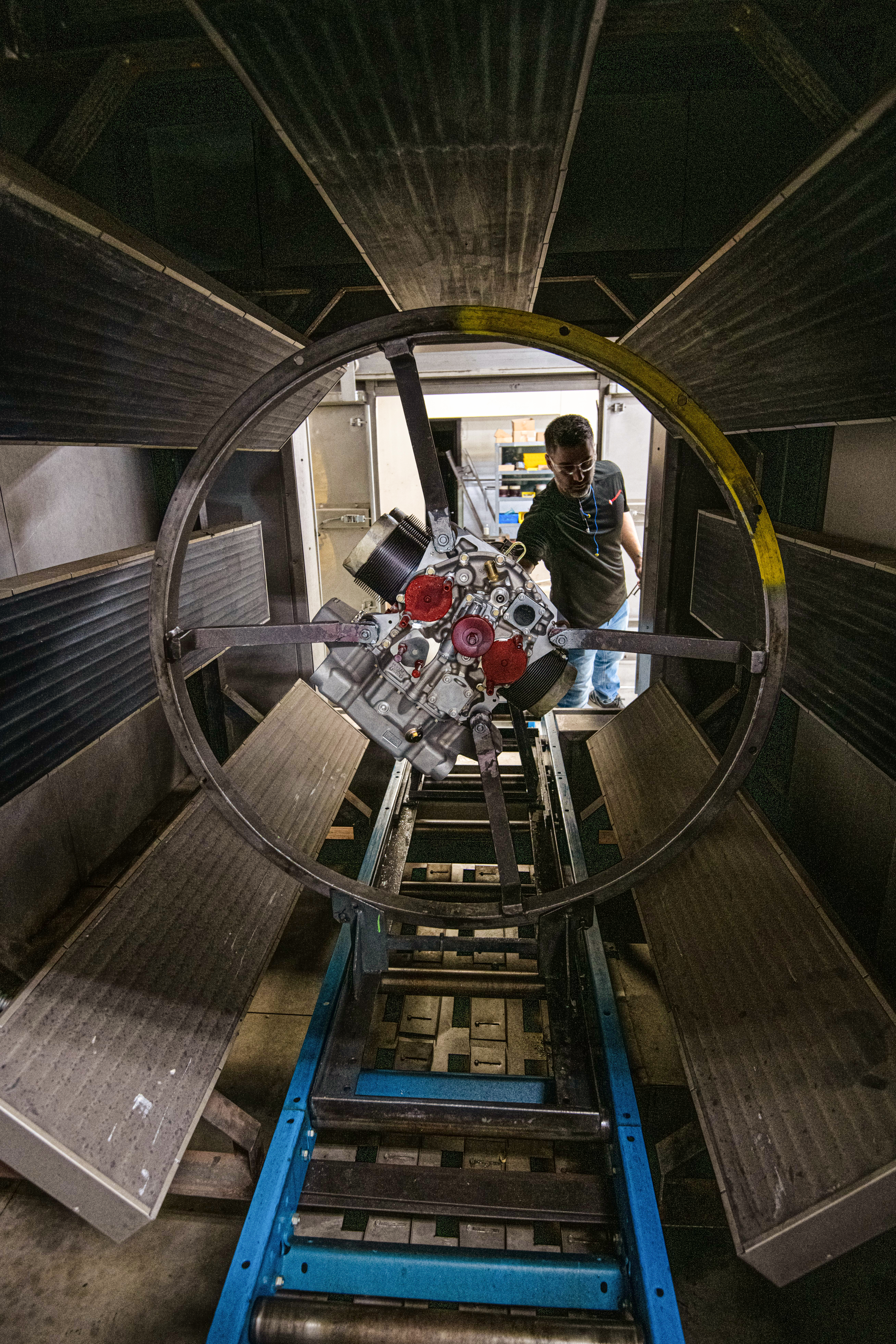 Thunderbolt technician Paul Zener puts an engine in an industrial dryer.