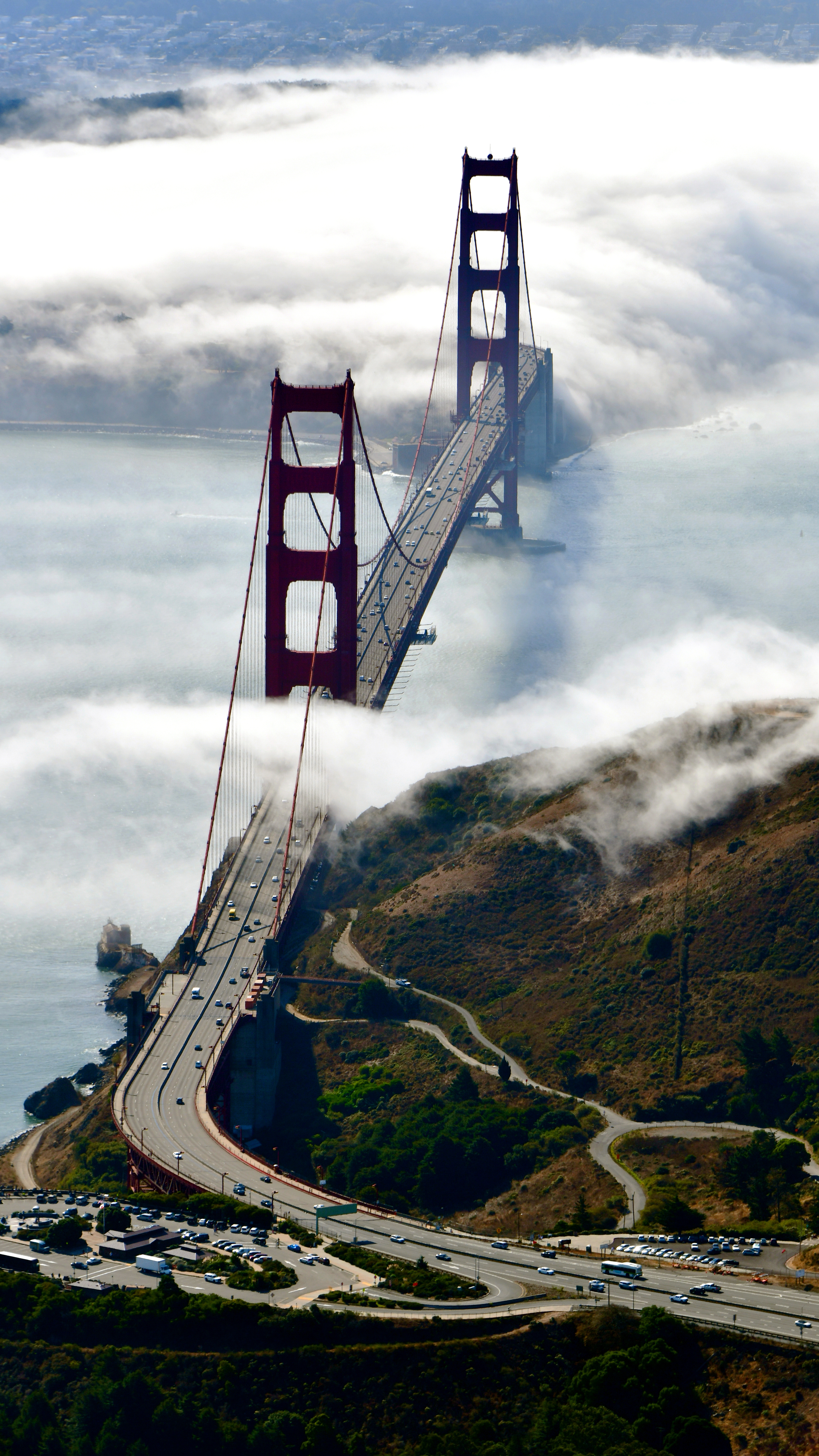 GOLDEN GATE BRIDGE, VISTA POINT, SAN Francisco, CALIFORNIA: 'I was giving Kodiak recurrent training to my friend Chris when we flew over the Golden Gate Bridge. The fog covered the south end. Chris gave me a tour of the Bay as we continued with the flight portion of his training. I had Chris make several turns around the bridge so I could get a good shot with the fog.'