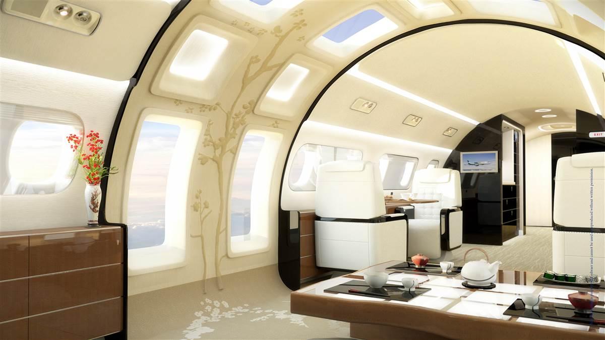 Embraer’s Kyoto concept interior was created with Asian clientele in mind. Passengers sit on the floor around the dining table, while taking in an airy ambiance. Expansive cabin windows make use of a cutting-edge technology: a hybrid metal called transparent aluminum. The view outside wouldn’t be crystal clear, but the scenery would be discernable.