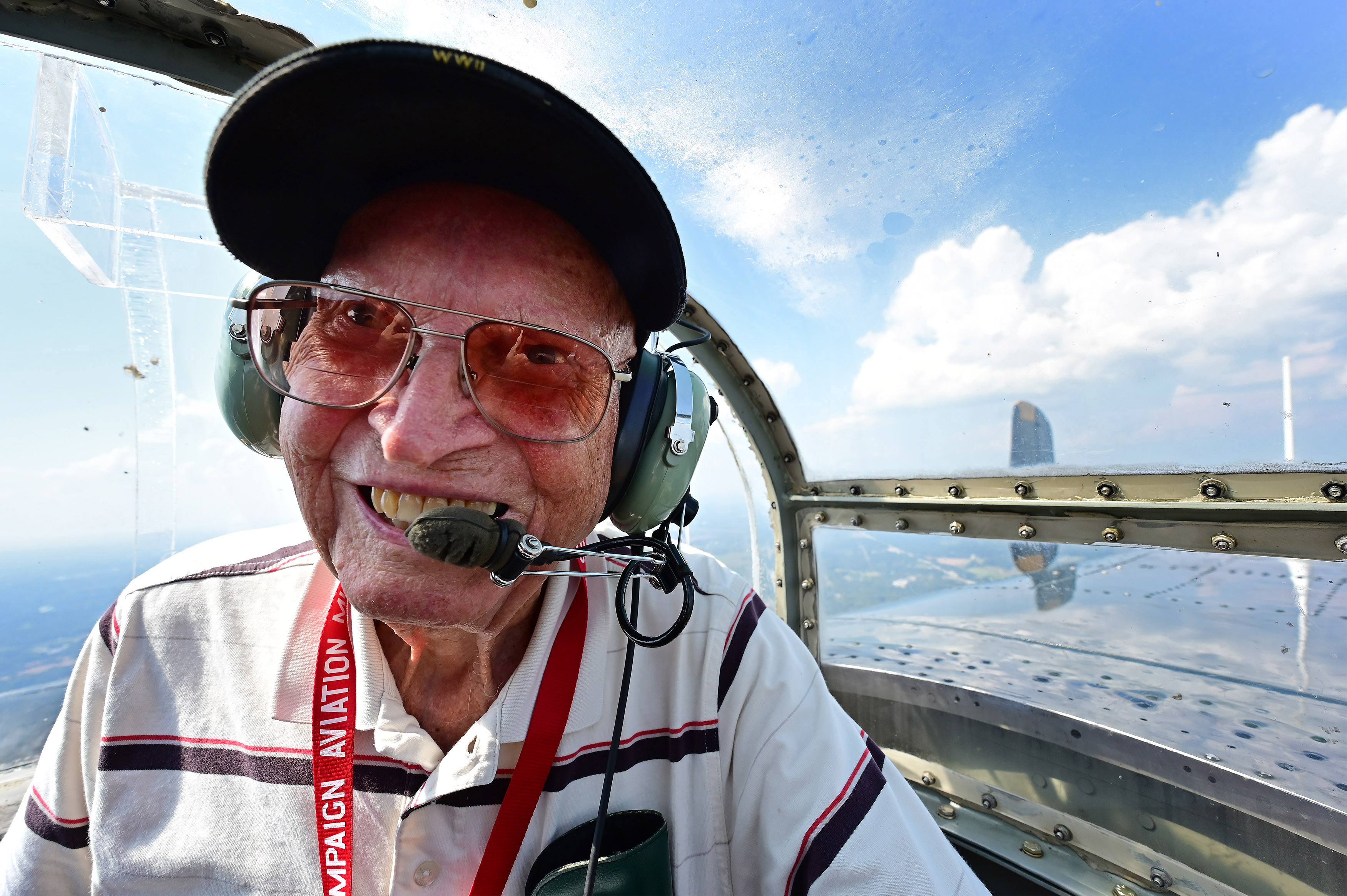 “Going Native for AOPA Fly-In Camping Fun,”: Sometimes it pays to be in the right place at the right time. Ninety-eight-year-old World War II Navy veteran Robert Penton enjoys the view from the turret of ‘Champaign Gal’, a North American B–25 that operated paid flights during the 2019 AOPA Fly-In at Tullahoma, Tennessee. (Nikon Z6, 14mm, 1/320, f8.0)