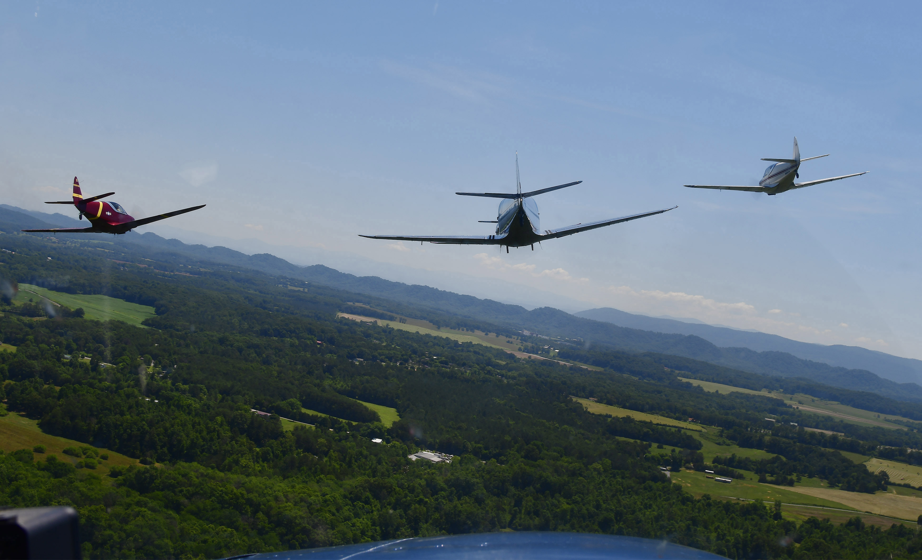 “Swift Pilots Celebrate Museum’s Golden Anniversary”: A formation of Swift aircraft with AOPA President Mark Baker riding shotgun in the center aircraft helped celebrate the 2018 Swift National fly-in in Athens, Tennessee. The trio was photographed through the windscreen of a fourth Swift flying in trail. (Nikon D500, 24mm, 1/160, f10)