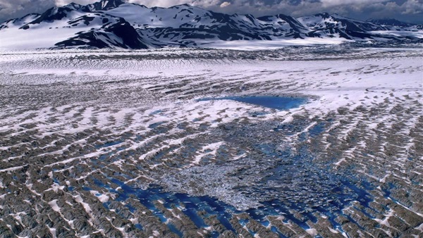 Blue pools of the Bering Glacier in southern Alaska from the summer of 2019. According to the National Park Service, Alaska’s glaciers are losing 50 gigatons of ice per year; although they account for about one half of one percent of all glacier/ice sheet cover on Earth, Alaska glaciers contribute about 9 percent of total ice melt. Paul Claus