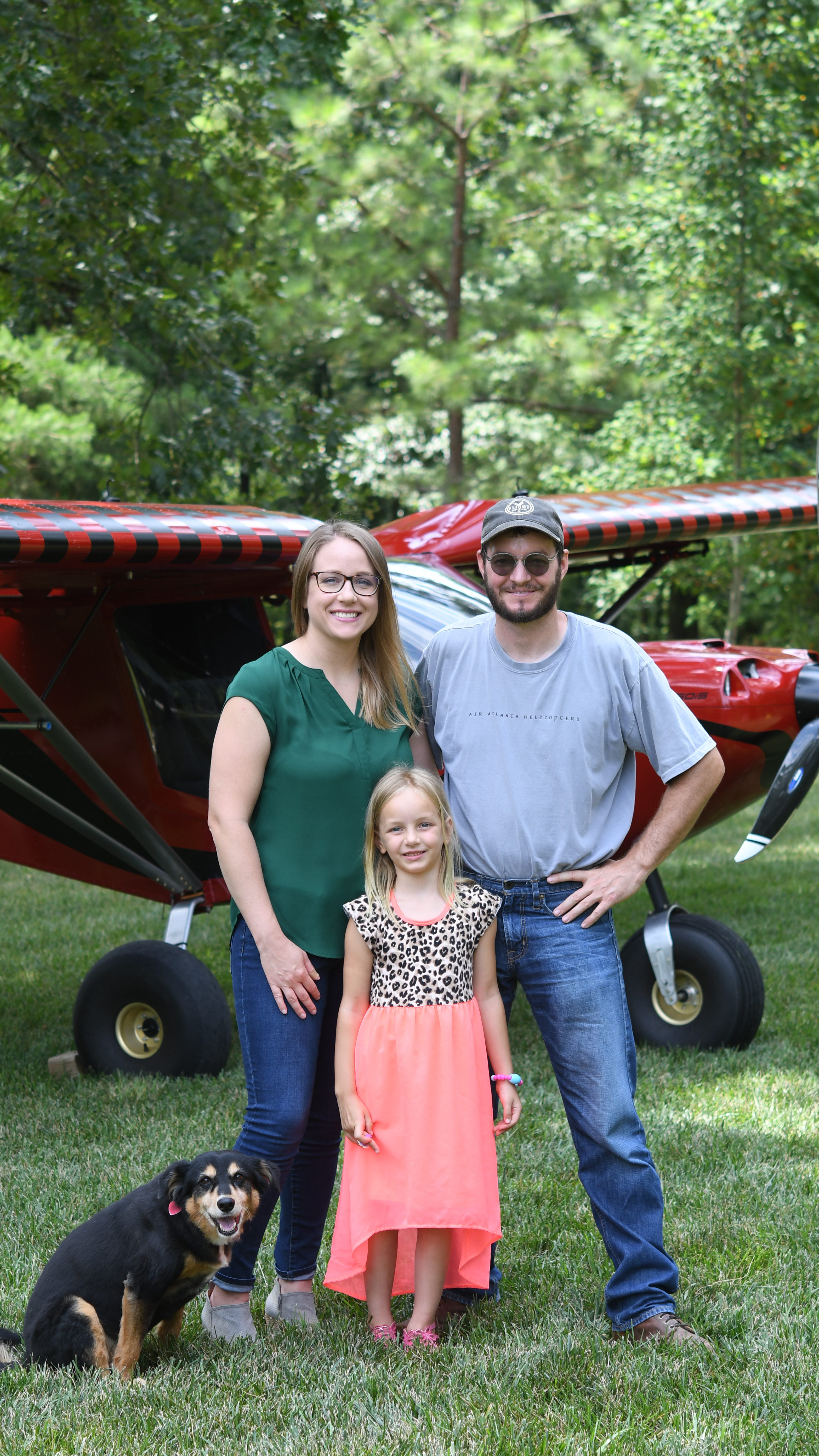 Jon Humberd poses with his wife April, daughter Joslyn, and family dog Abby. 
