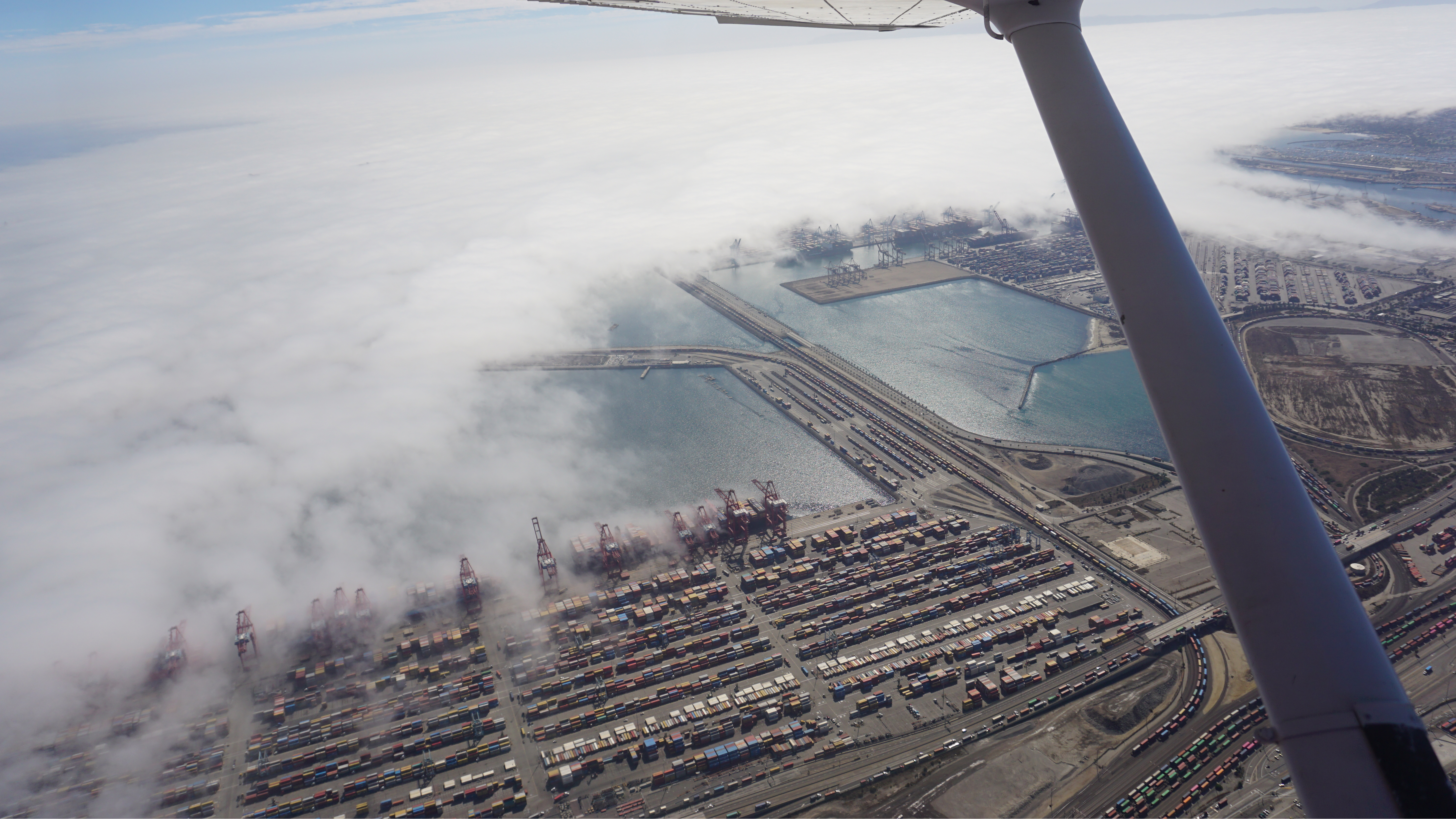 A persistent marine layer creeps into the Port of Los Angeles near Zamperini Field.