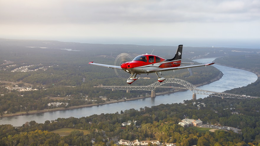 AOPA You Can Fly Champion Michael Goulian flies his Cirrus SR22 over the Cape Cod Canal.