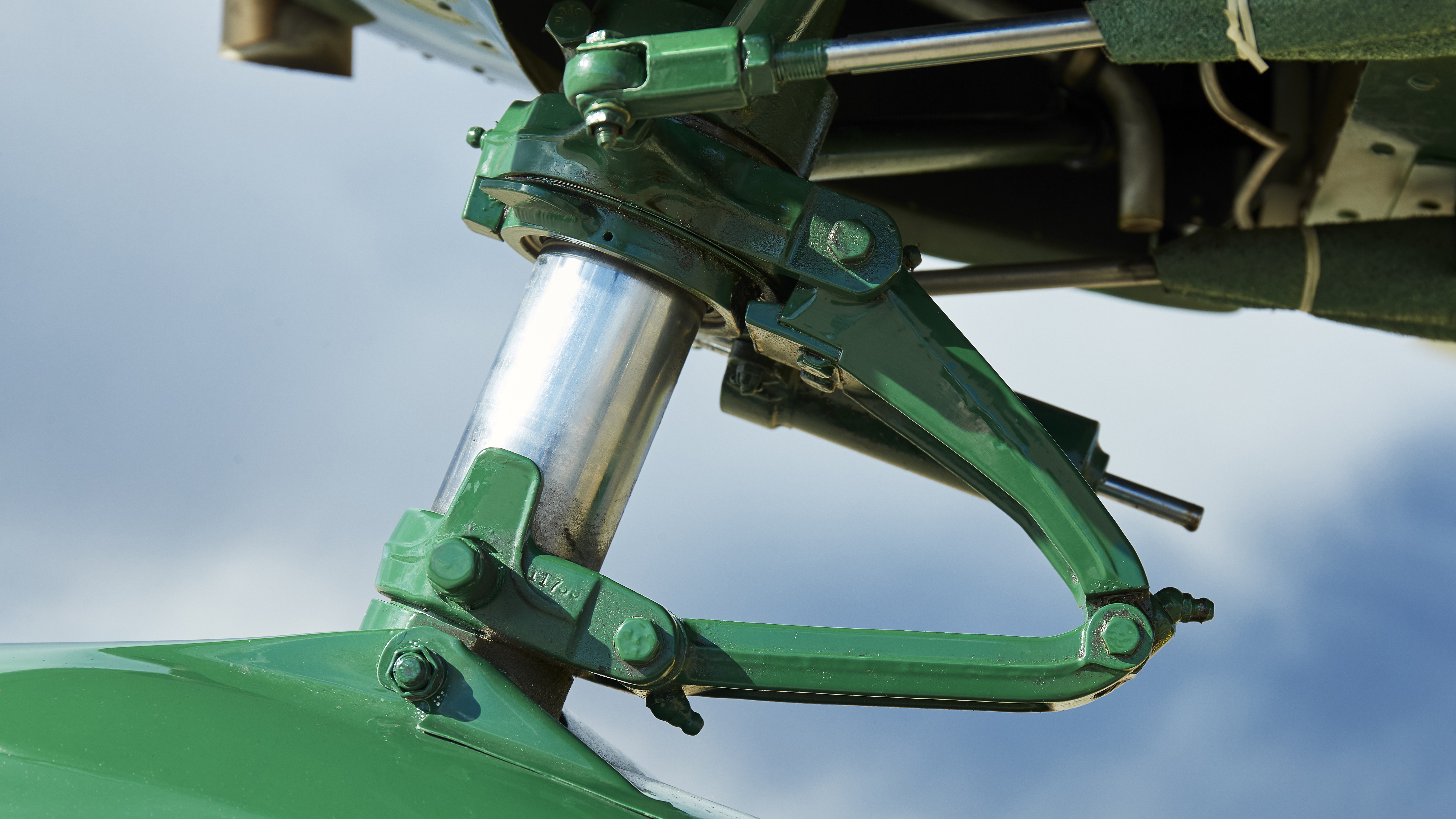An astonishingly clean nosewheel strut. Note the lacing tape on the steering rod boots.