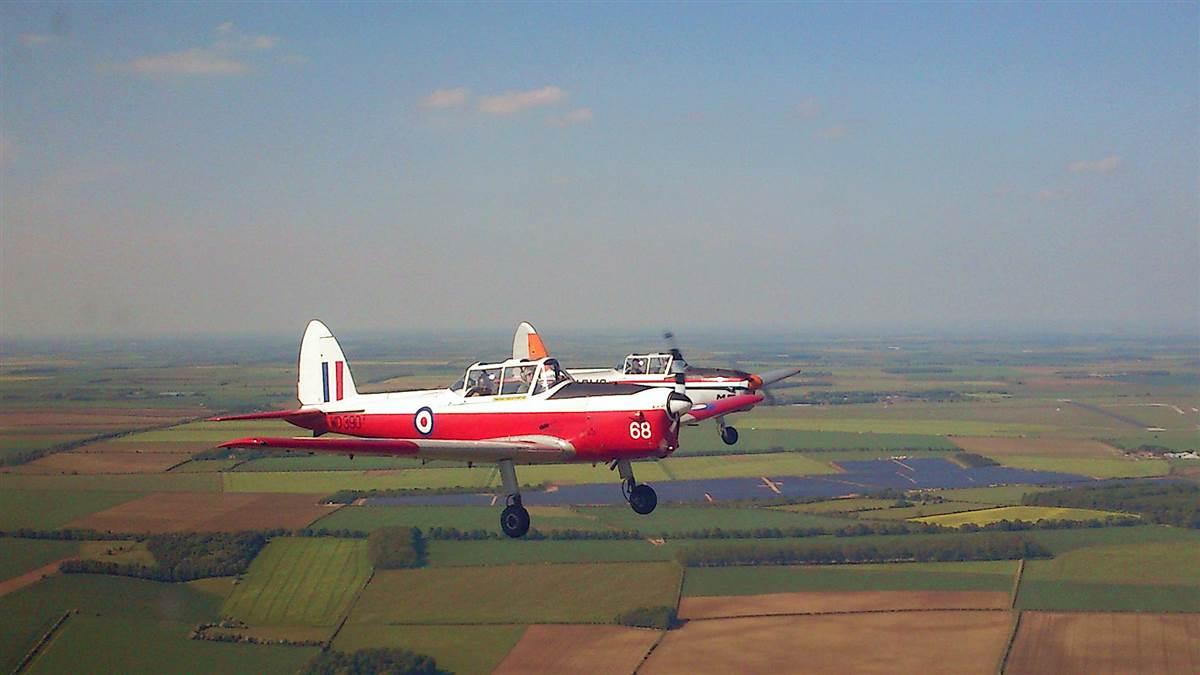 A pair of Chipmunks fly over the RAF base at Cranwell.