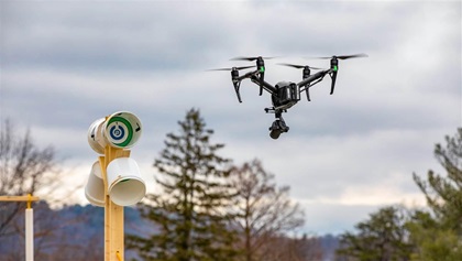 Variations on the open test lane were set up by NIST staff at a March 2020 conference of public safety professionals in Virginia. A DJI Inspire 2 is pictured here flying an obstructed test lane that incorporates taller stands and obstacle.;