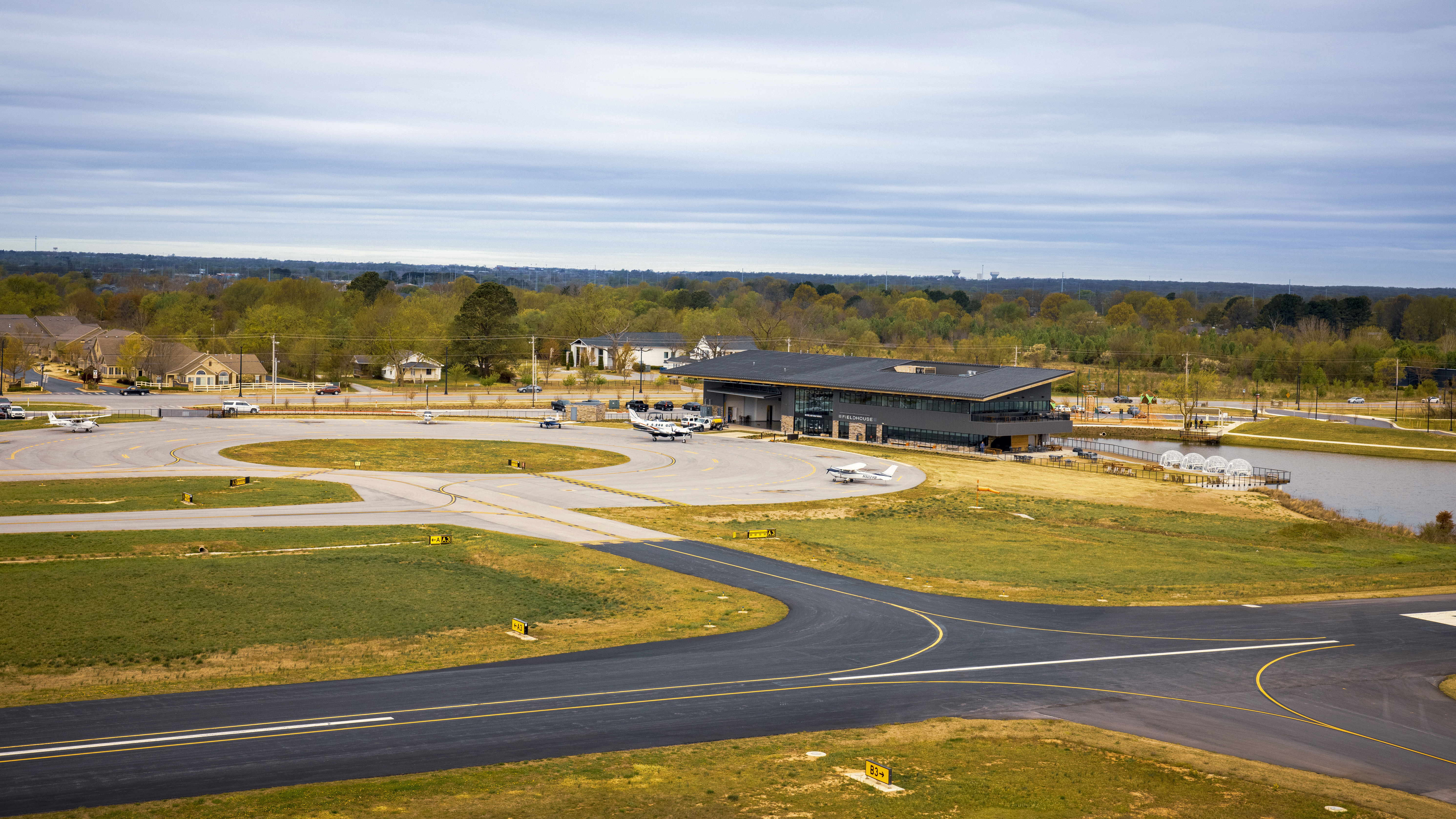 The modern FBO and distinctive circular ramp distinguish Summit Aviation.