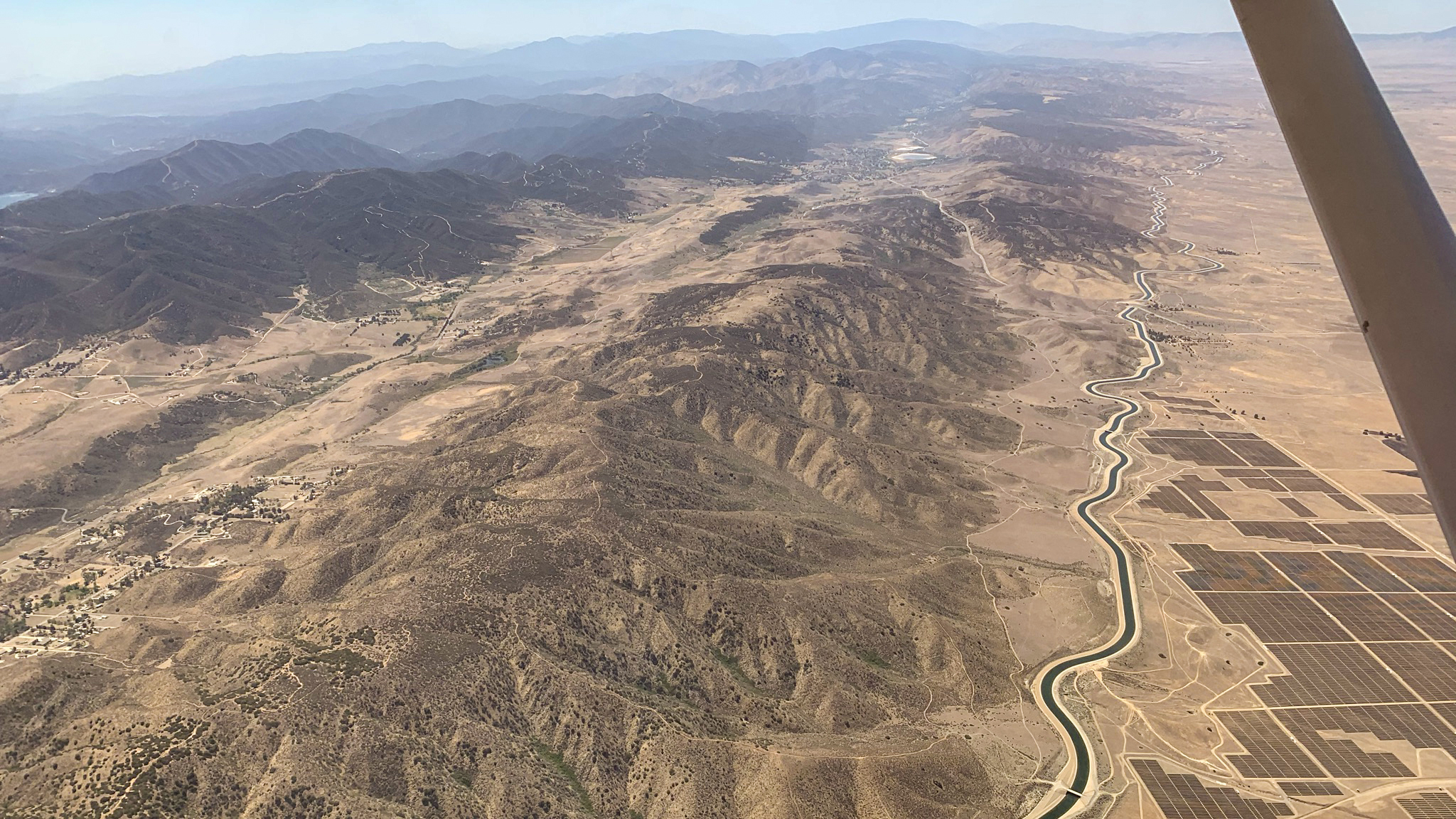Crossing an aqueduct into the desert near Lancaster. It was the last water the author saw until reaching the Stovepipe Wells oasis.