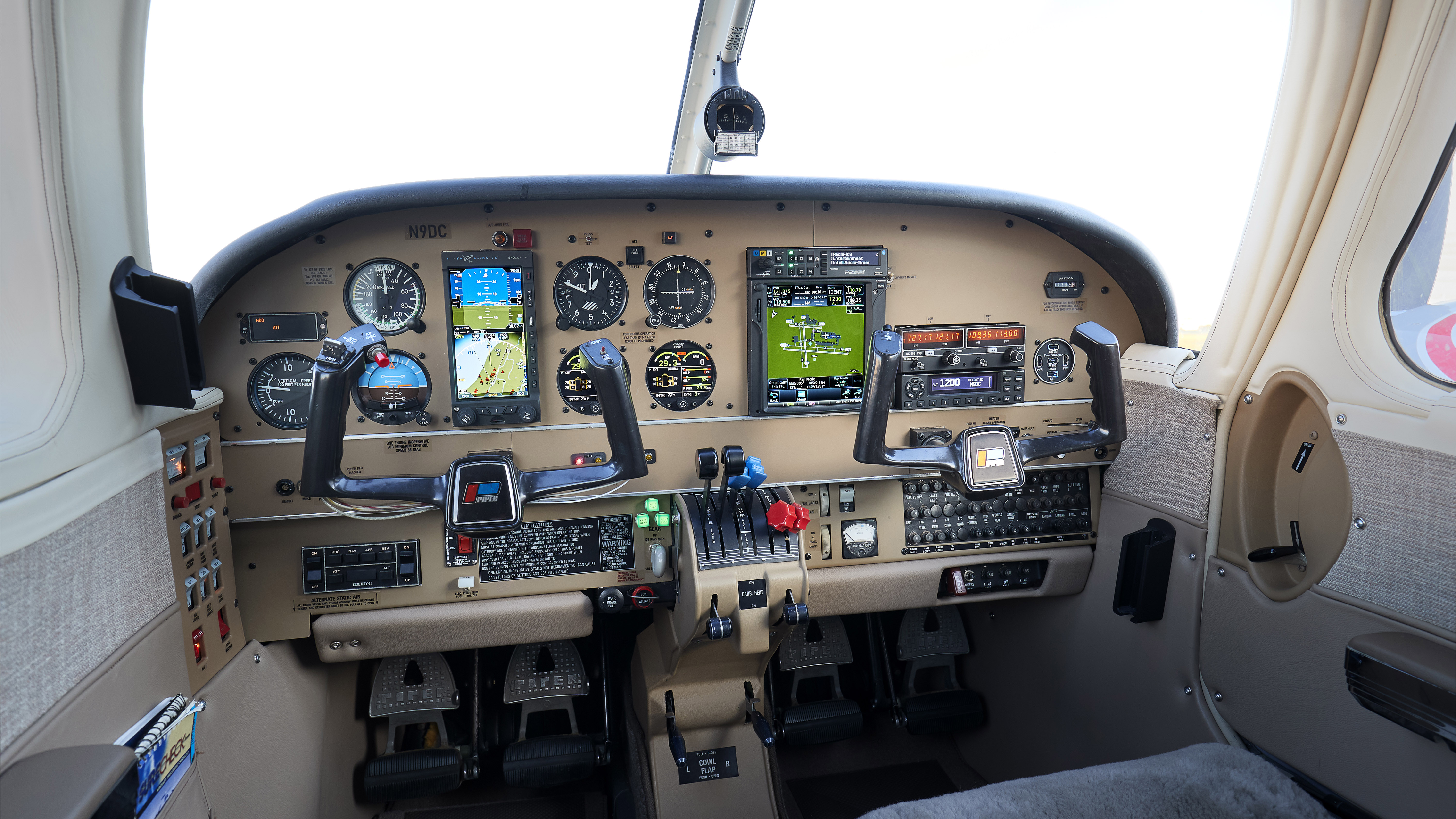 Panel standouts are an Aspen Evolution Pro Max PFD with altitude preselect, a Garmin GTN 750 navigator, and twin Electronics International CGR-30 engine and system monitoring indicators.