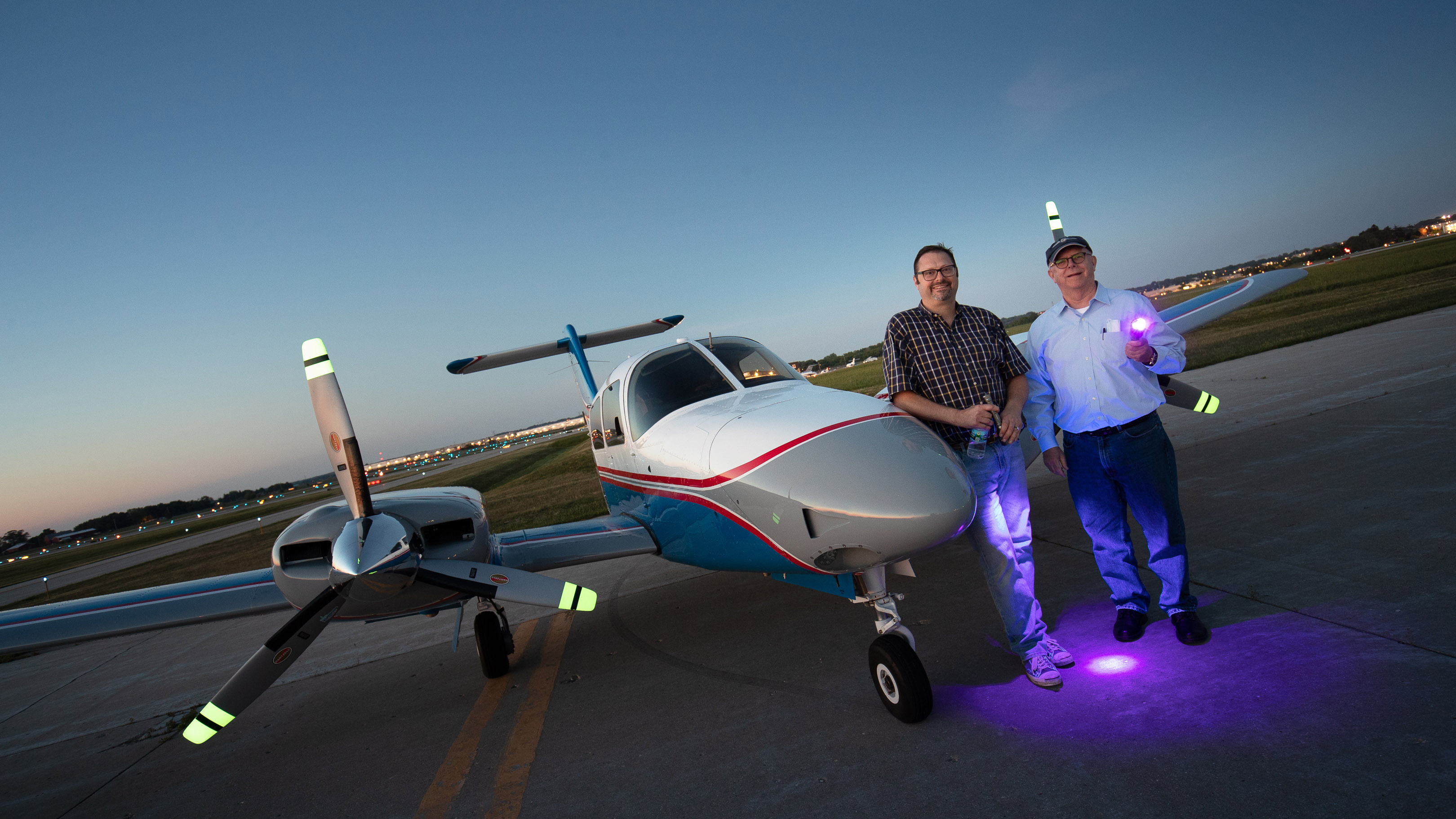 Dave Coleman and the author show off the UV flashlights used to energize the prop-tip glow.