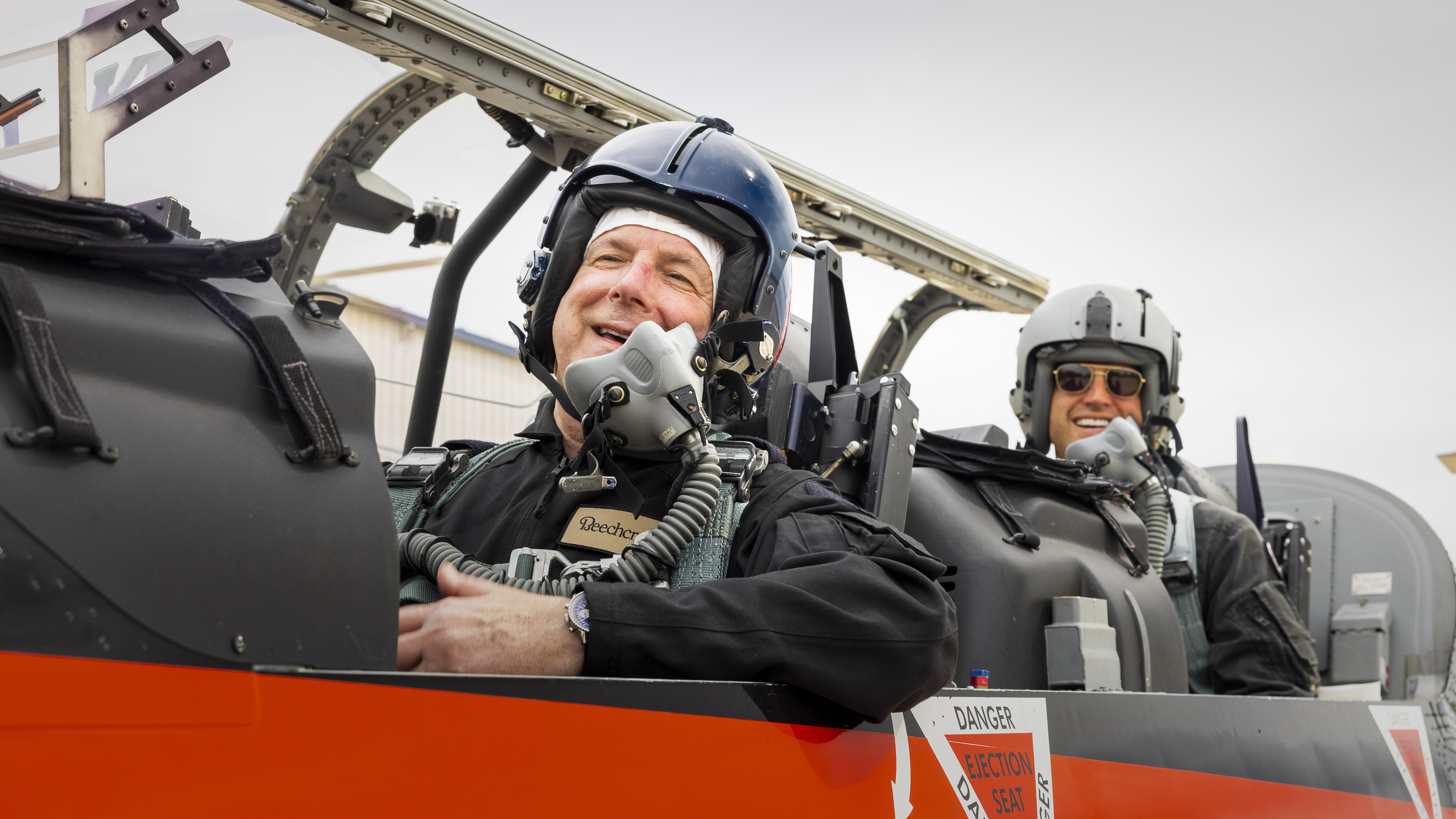 Post-flight, Tom Horne and Chip Schellhorn (front and rear seats, respectively) celebrate before heading to a debriefing session.