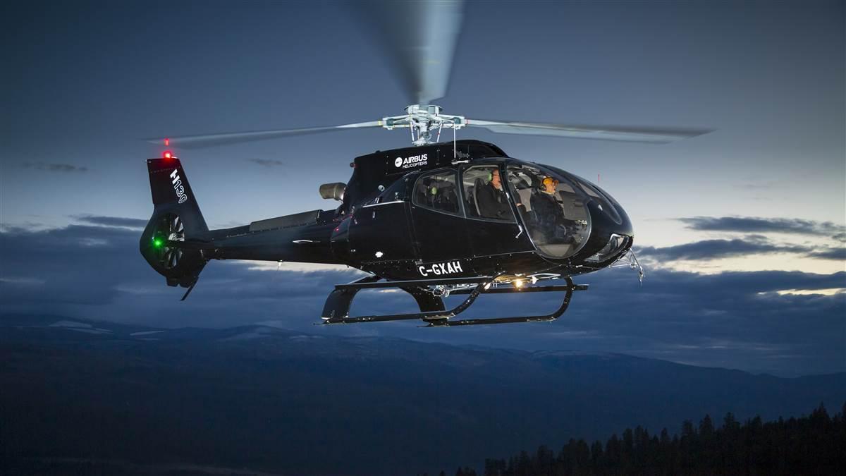 A black Airbus H130 lights up nicely when illuminated by three strobes.