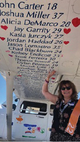 The underside of the wings of Ron Cuff’s Cessna 182, painted, with the names and ages of children who lost their lives to alcohol and drug addiction, by their parents.