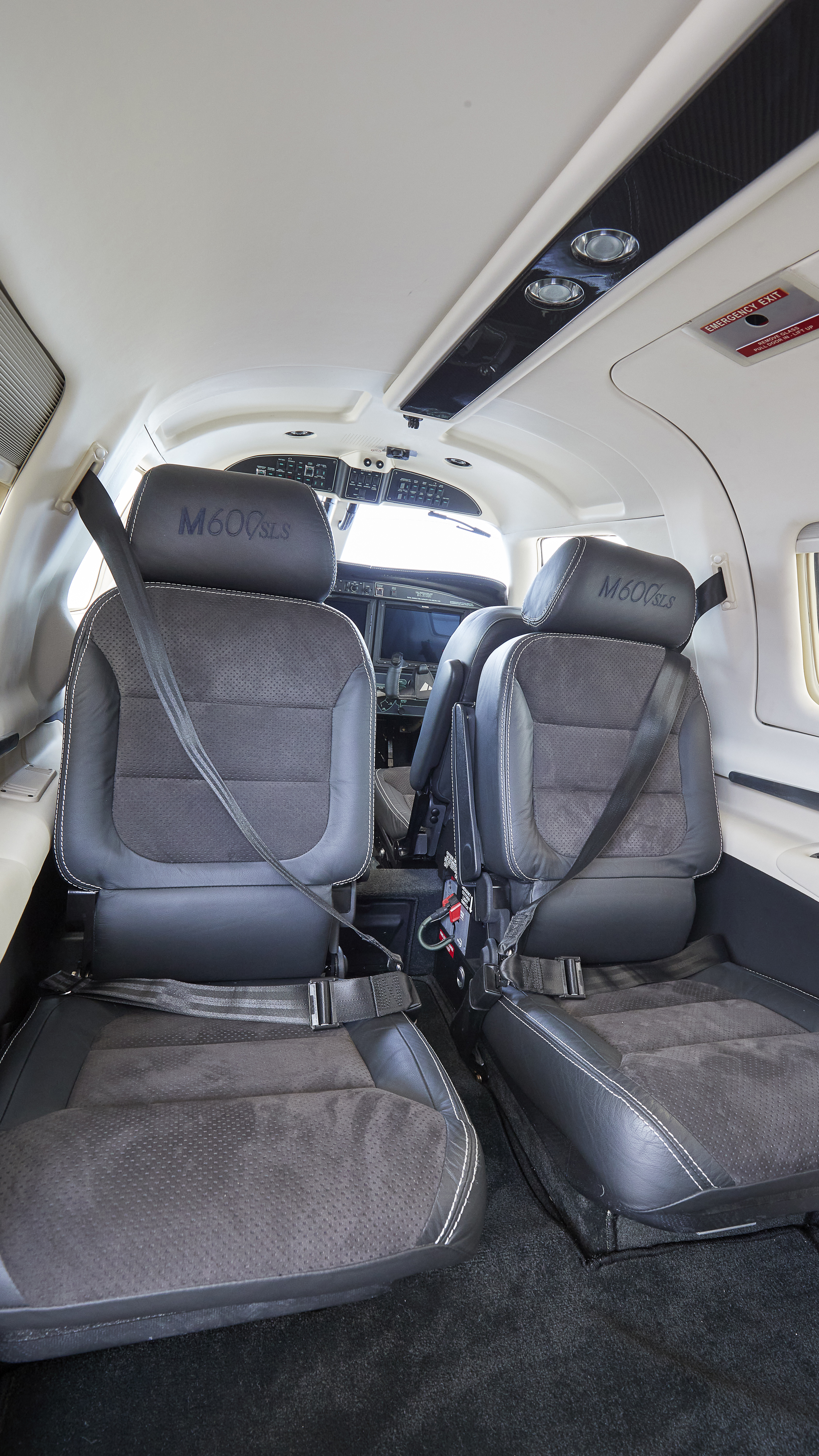 The airplane’s seats carry embossed “M600/SLS” badges.