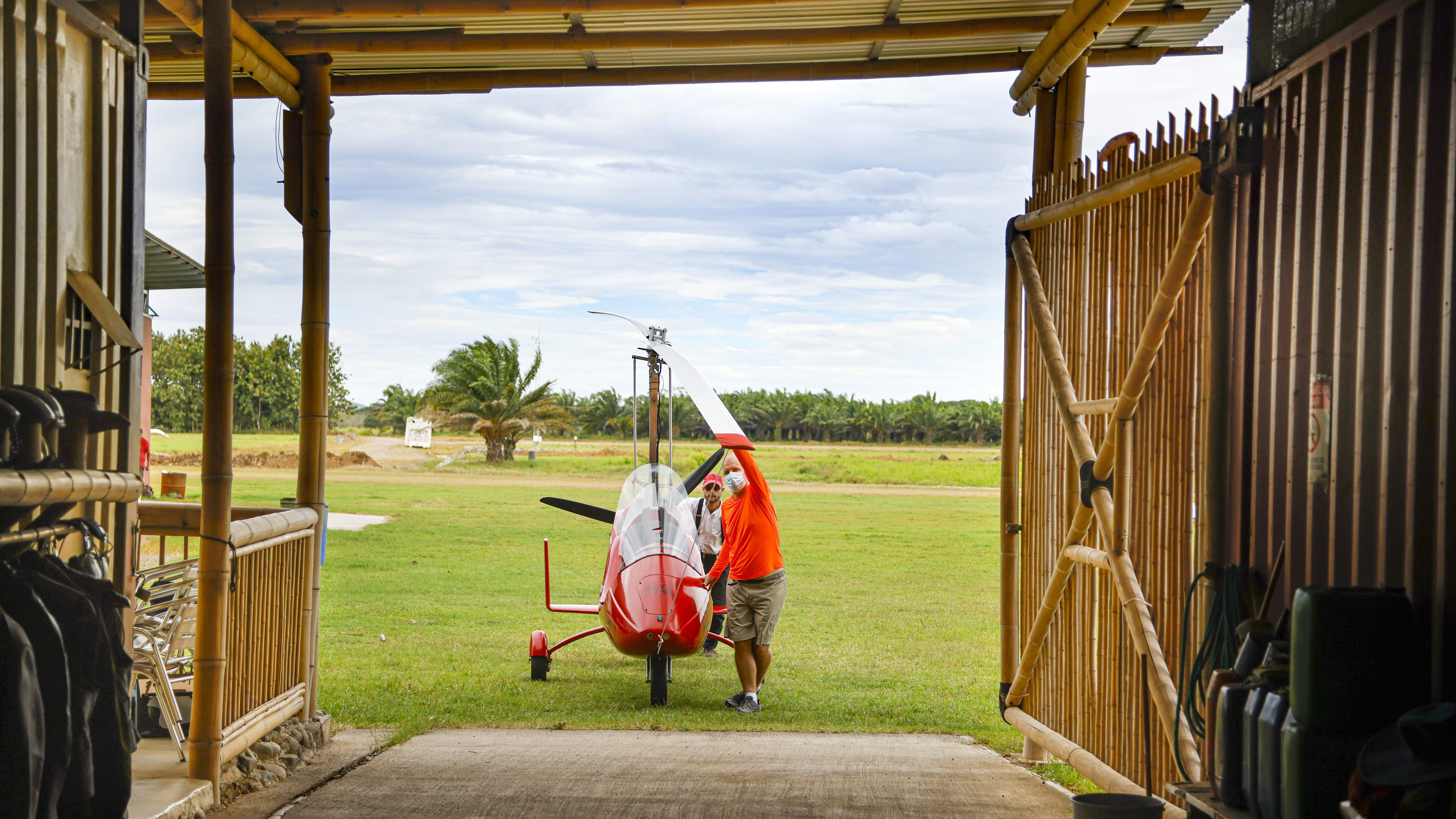 The Nierhoffs are widely known for their expertise and thoughtful training methods. Pictured are the author and Niklas Nierhoff pushing the gyrocopter into the hangar.