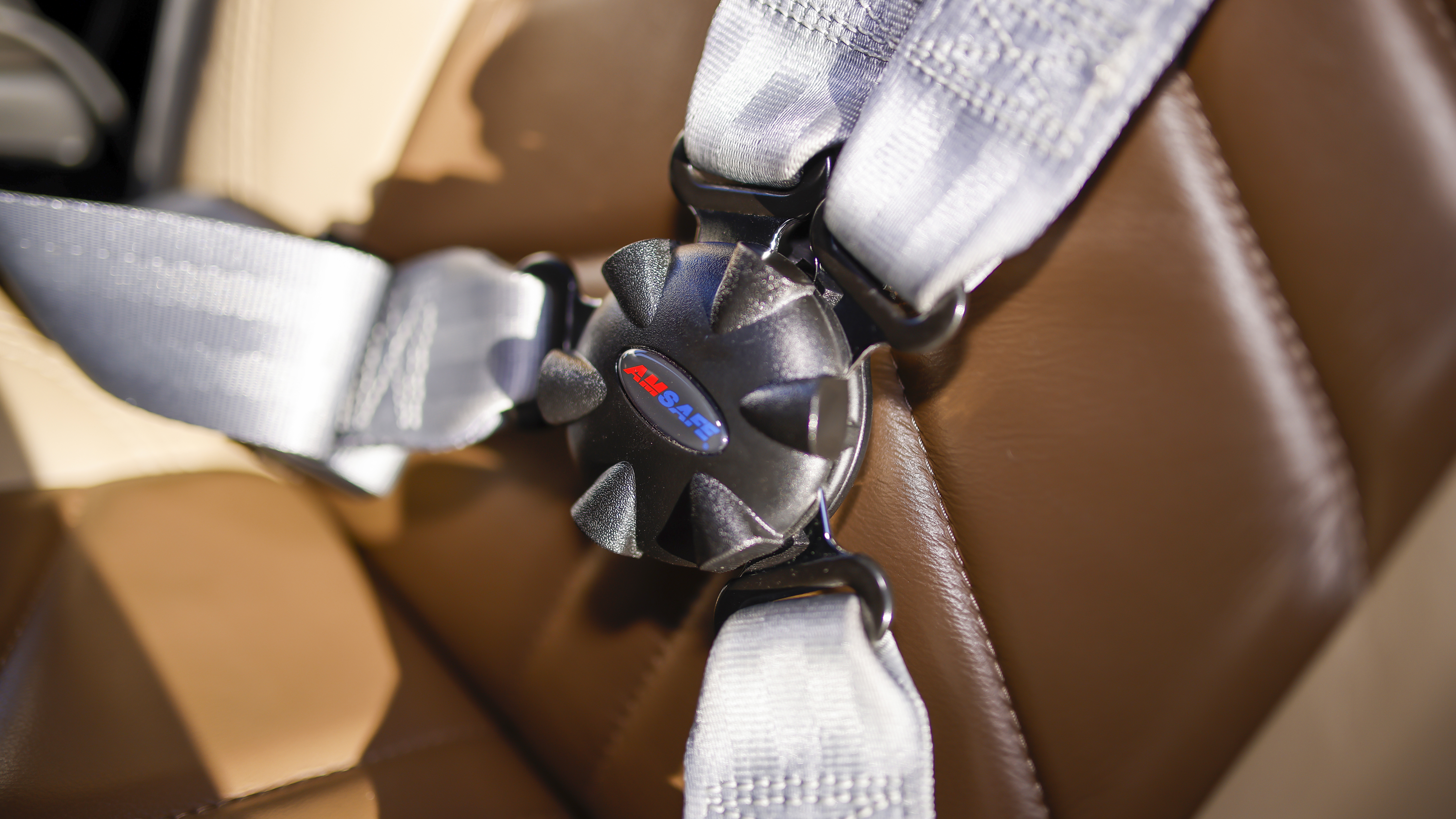 The cockpit seats have four-point restraint harnesses with integral airbags.