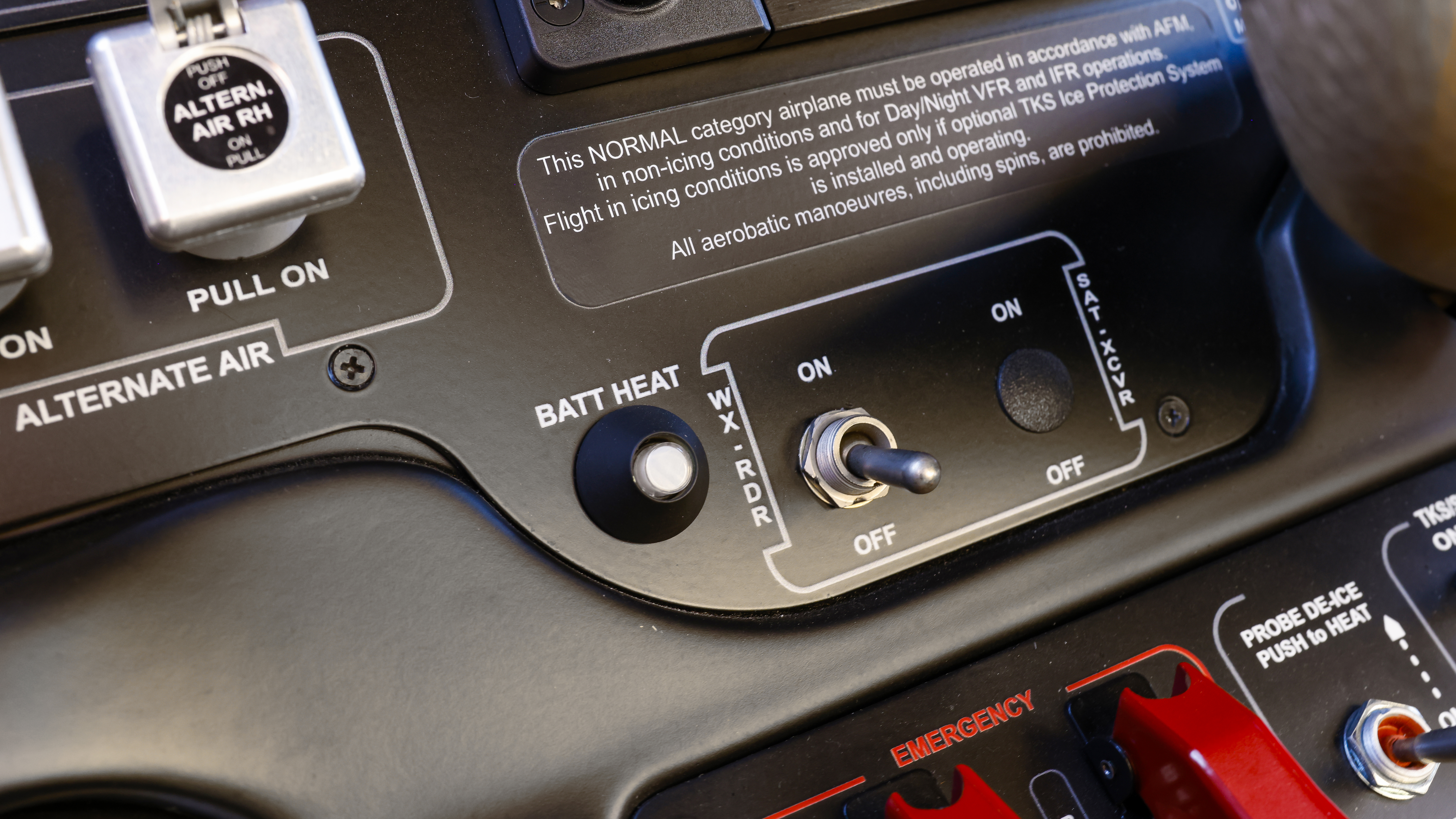 Onboard weather radar on-off switch panel and lithium battery overheat warning light.