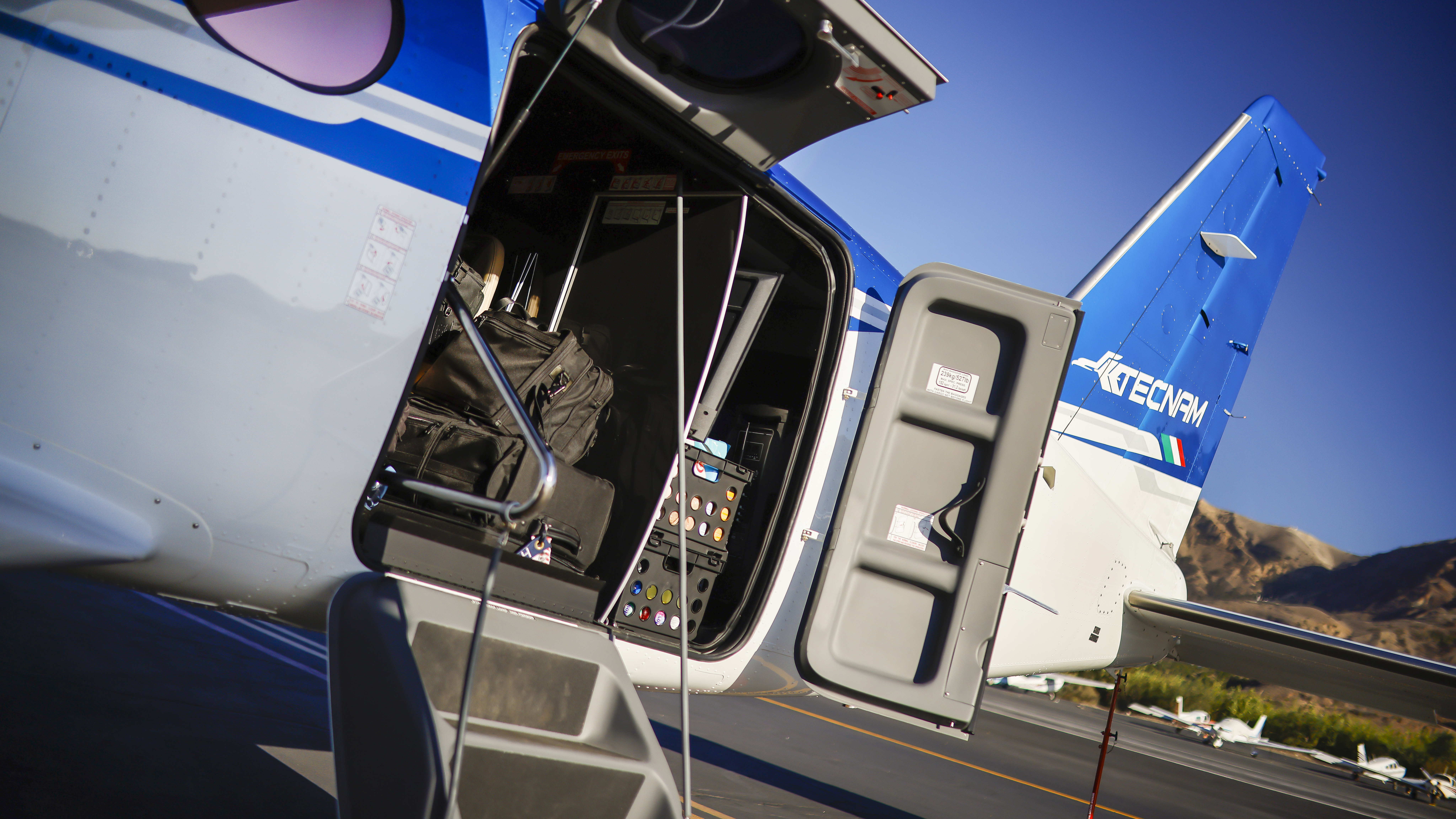 The massive aft cargo door accepts most palletized loads and also serves as a passenger entry.