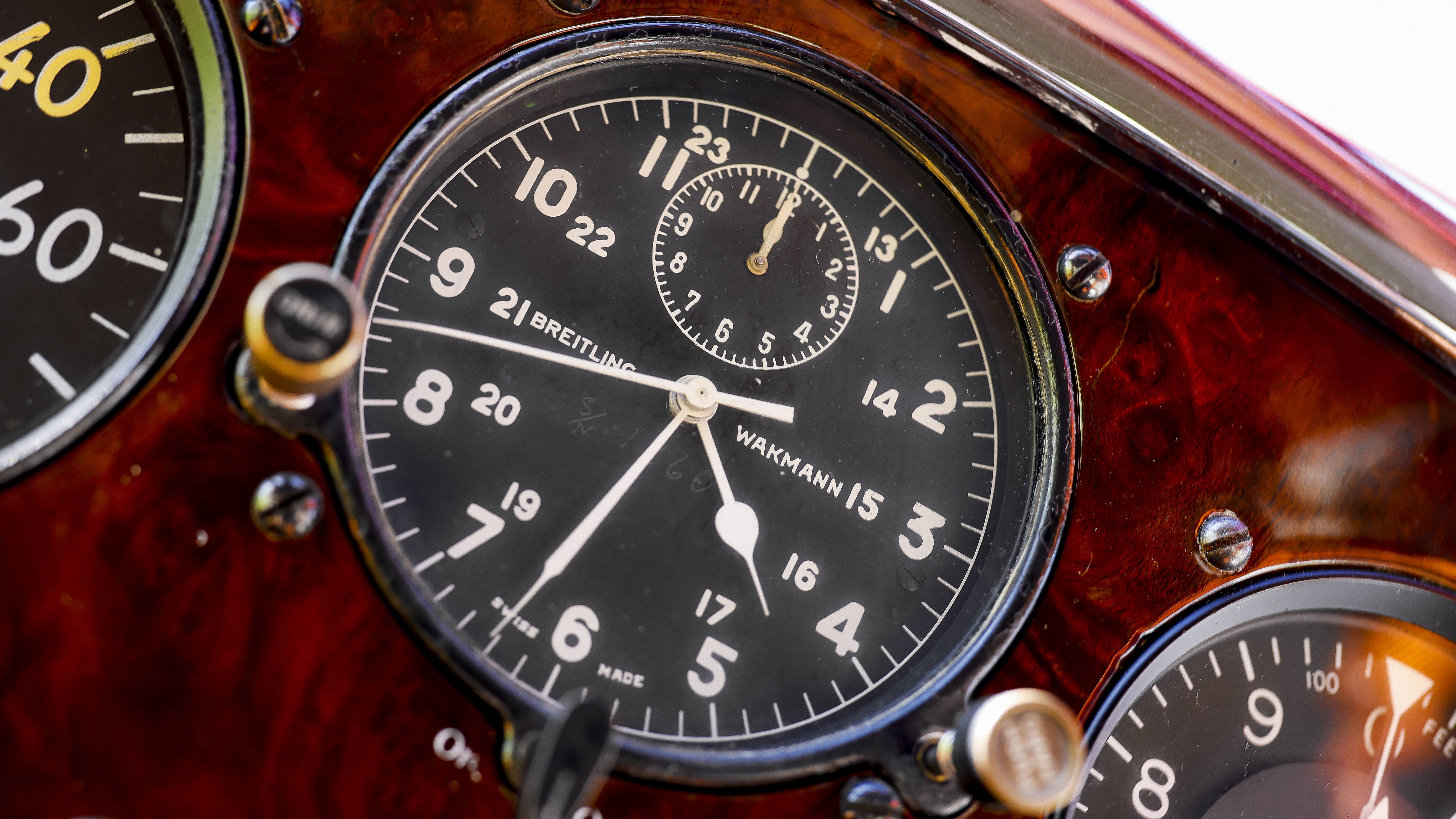 A Breitling clock is part of the interior.