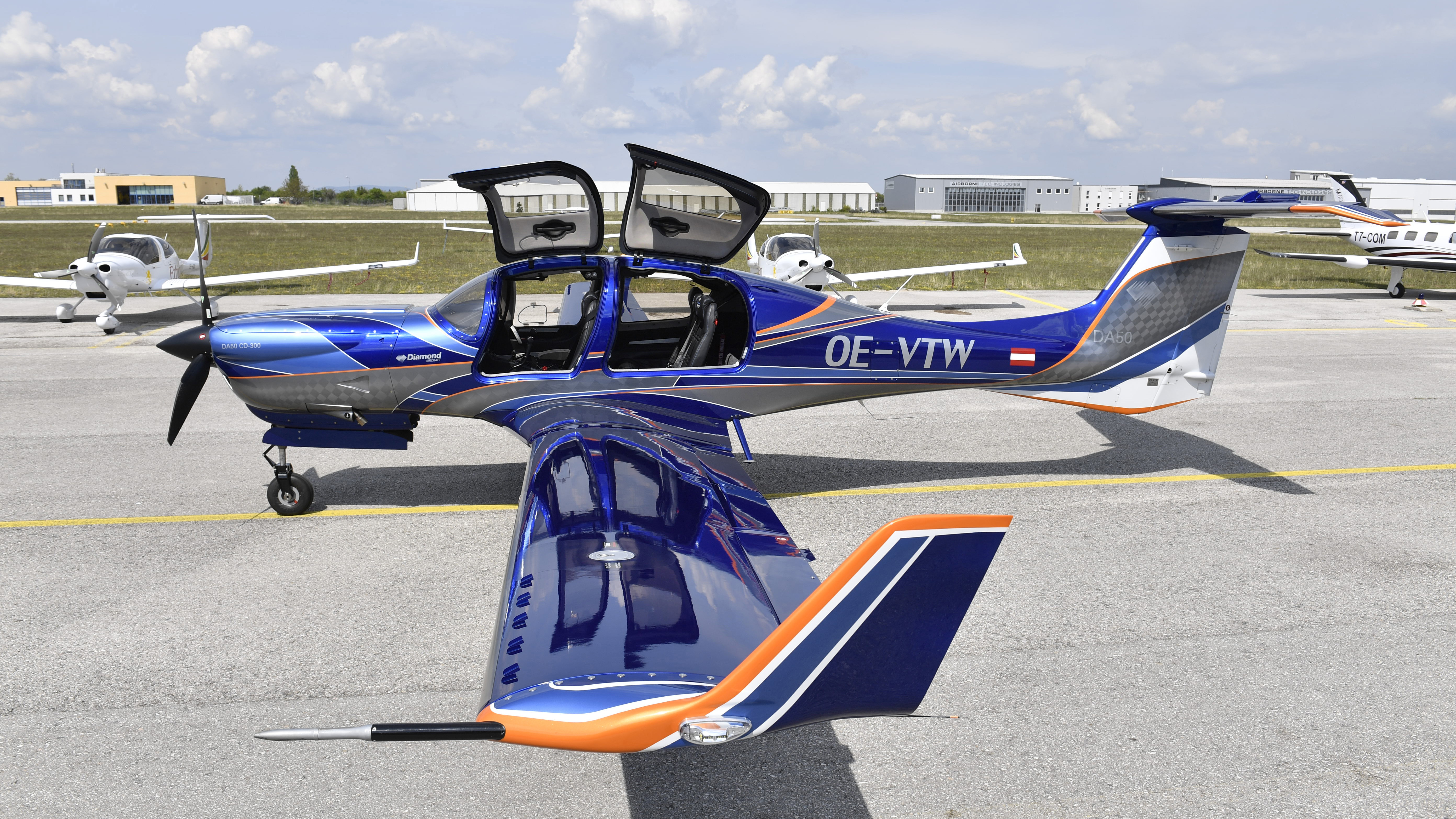 VGs at the wing tips, plus the huge gull-wing doors and interior, are distinguishing features.