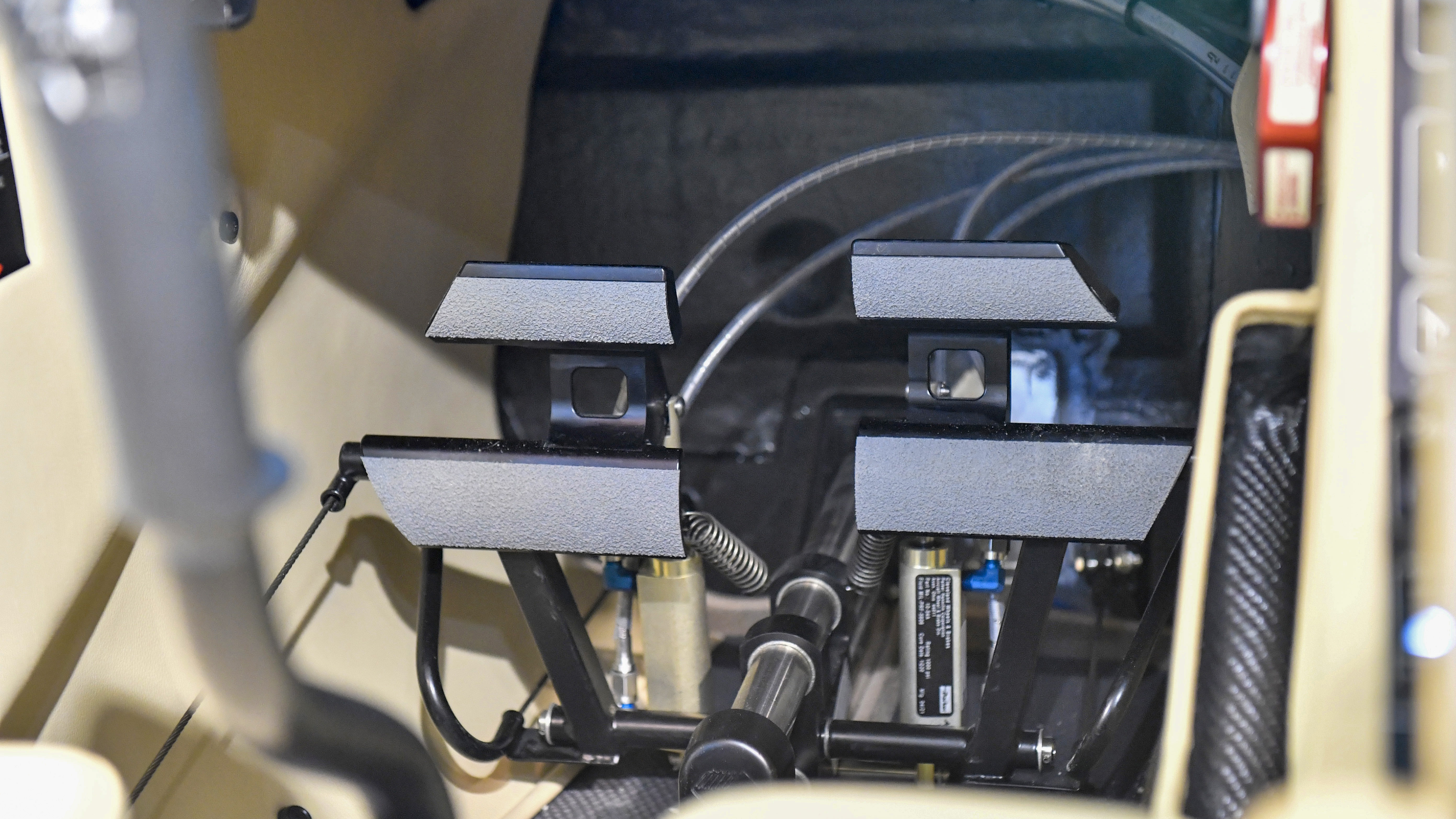 Electrically adjustable rudder/brake assemblies let pilots make fore and aft adjustments. Diamond seats are attached to two spars in the central spar box, which fixes them in place and gives them their crashworthiness. Seats recline, however, and there is adjustable lumbar support.