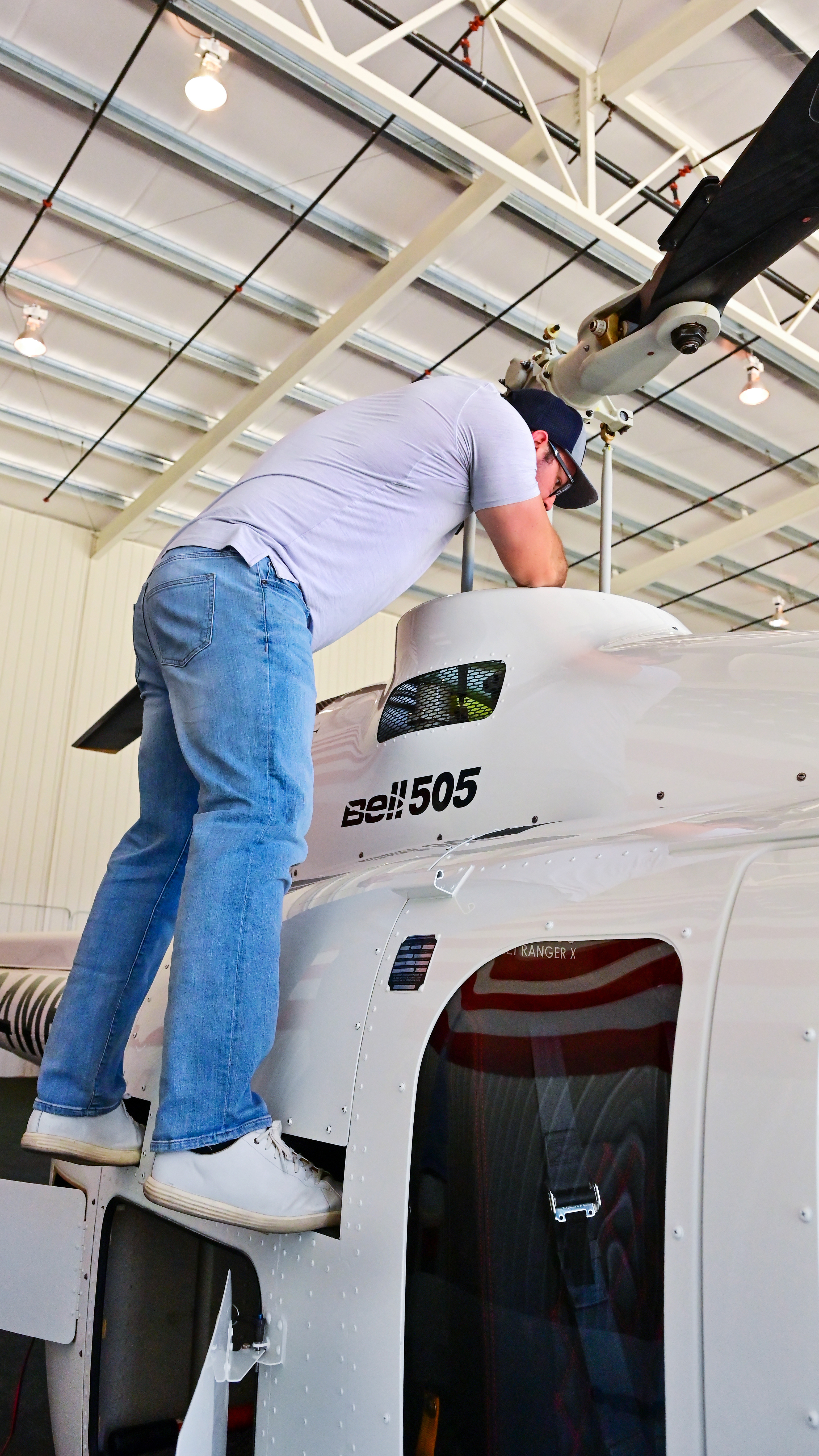 Mike Bradley is understandably proud of his distinct white 505, his first helicopter.