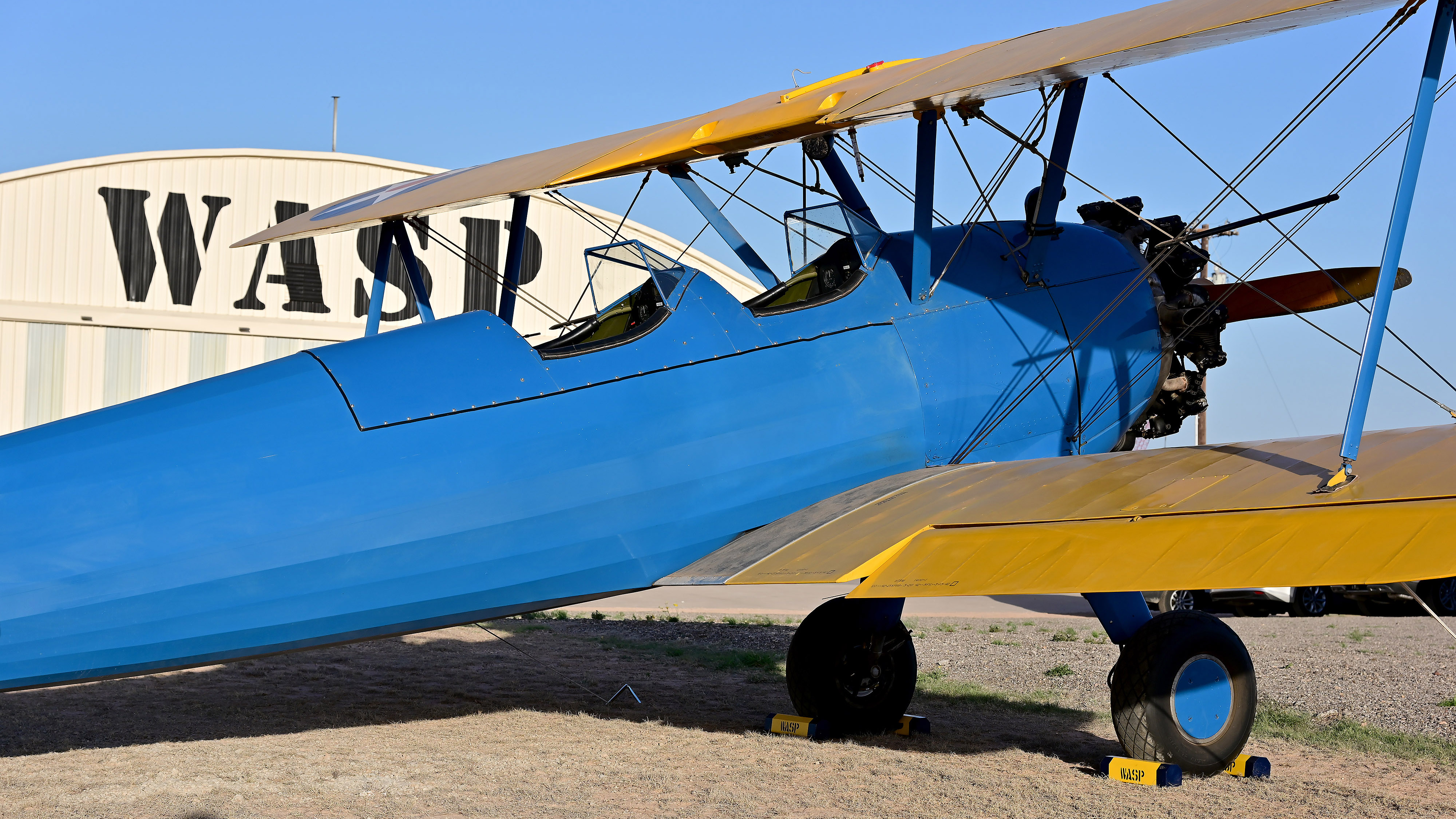 A Boeing Stearman PT-17 Kaydet sits in the sun in front of the WASP WWII Museum in Sweetwater. The WASP flew Kaydets like this one in primary training, along with military forces elsewhere.