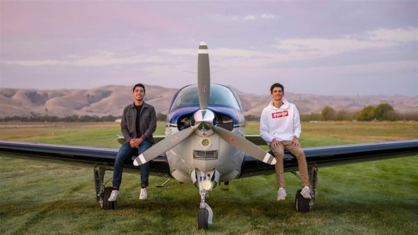 Owen Leipelt and Jeff Alan pose for a photo on the wings of their freshly painted 1988 Beechcraft Bonanza F33A at Frazier Lake Airpark in Hollister, California.