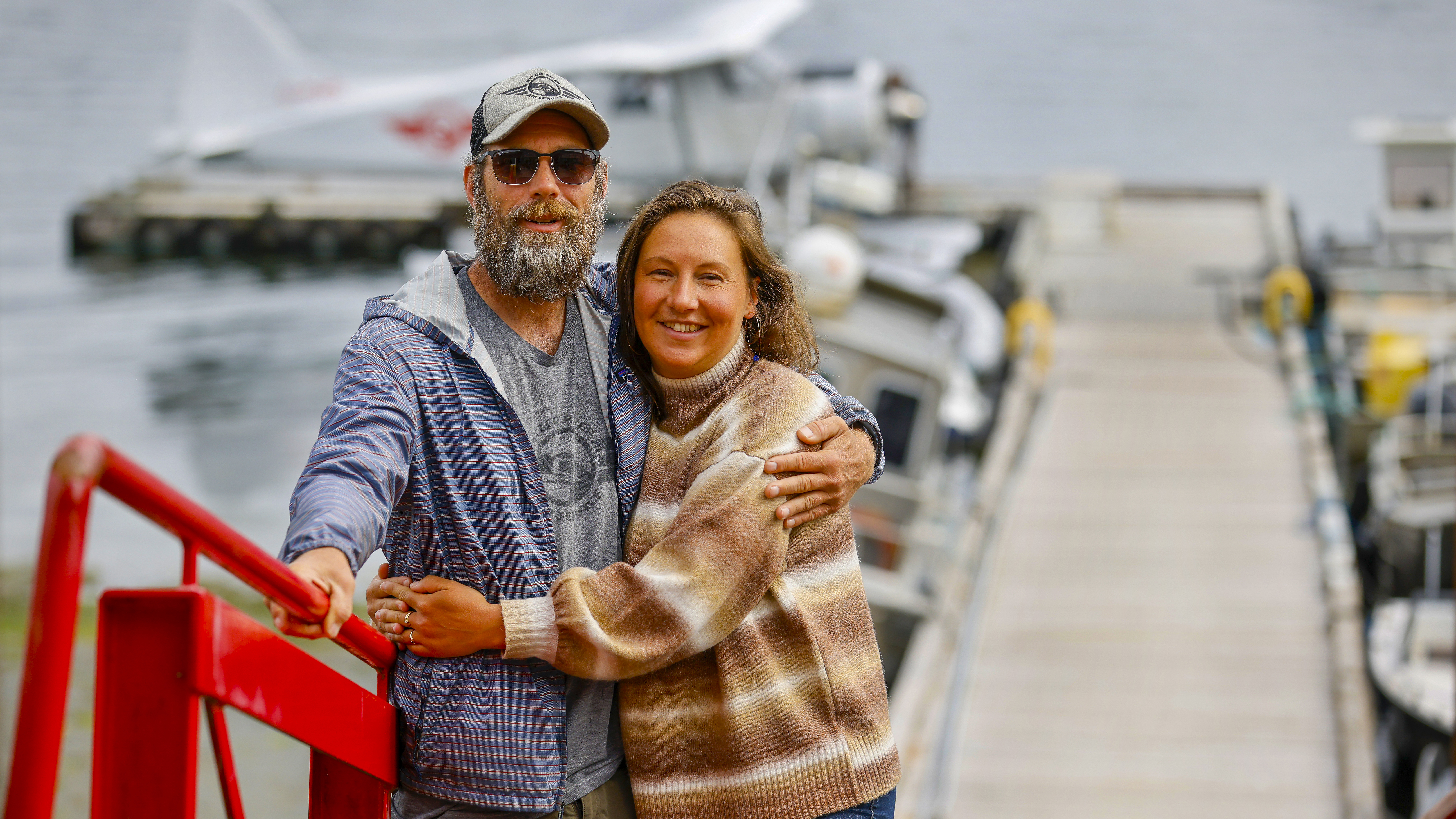 Jason Bertin and Misty Lawson on the dock at their seaplane business Atleo Air Service.