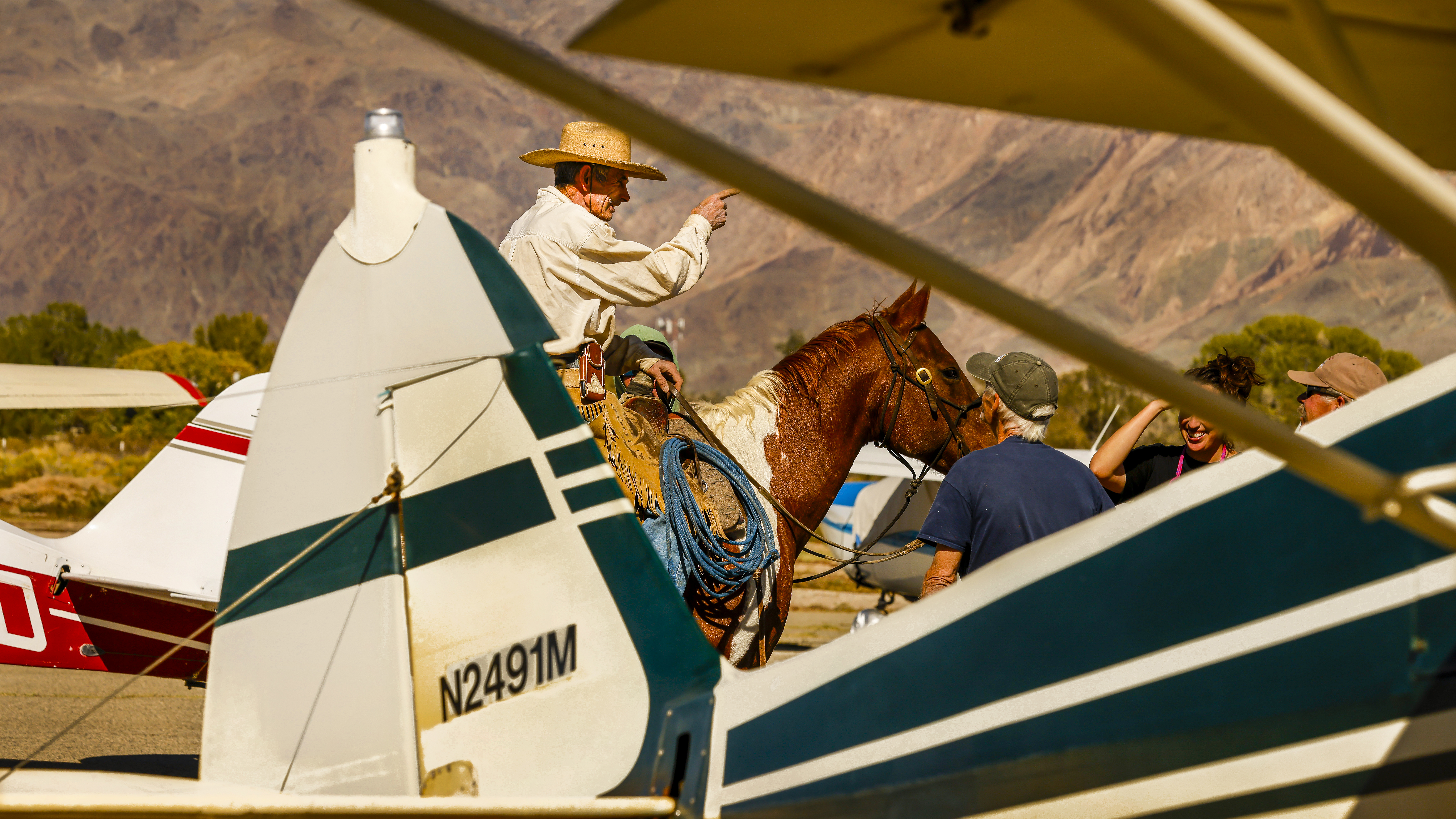 Dustin Mosher and a rancher chat on the ramp.