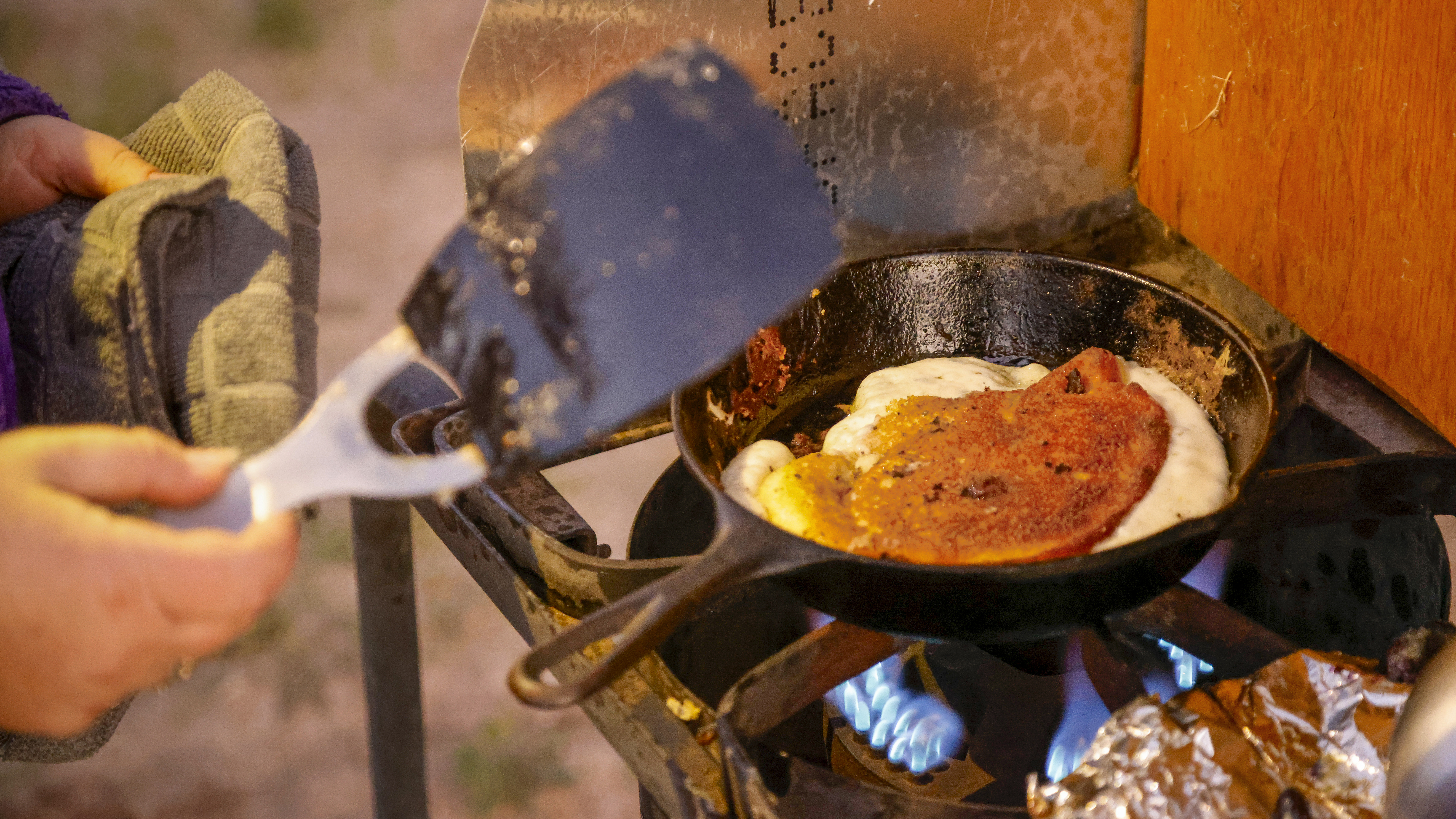Campers make pancakes for breakfast.