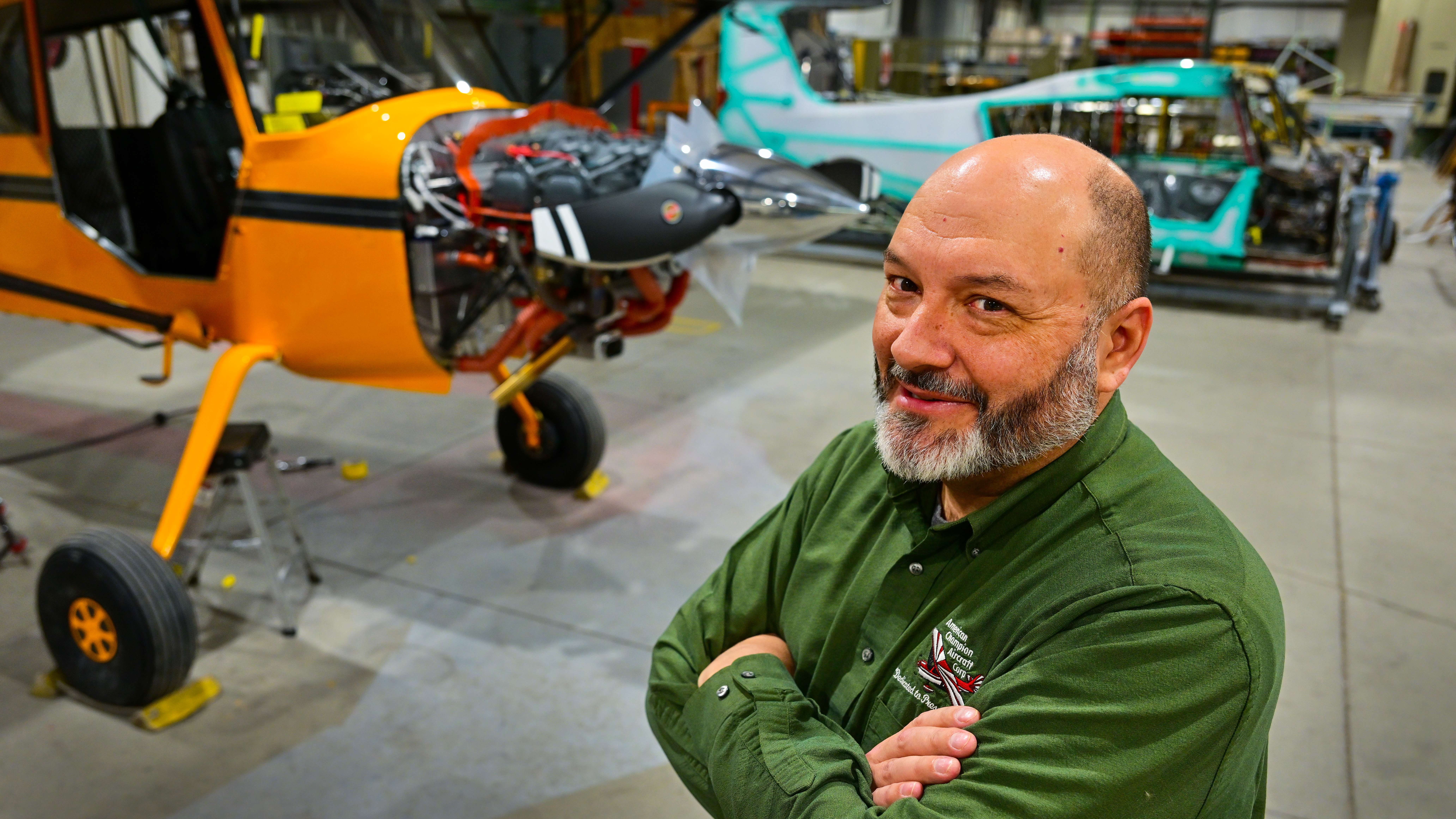 ACA Engineering Vice President Jerry Mehlhaff Jr. poses for a portrait near a new Scout model on the factory floor.
