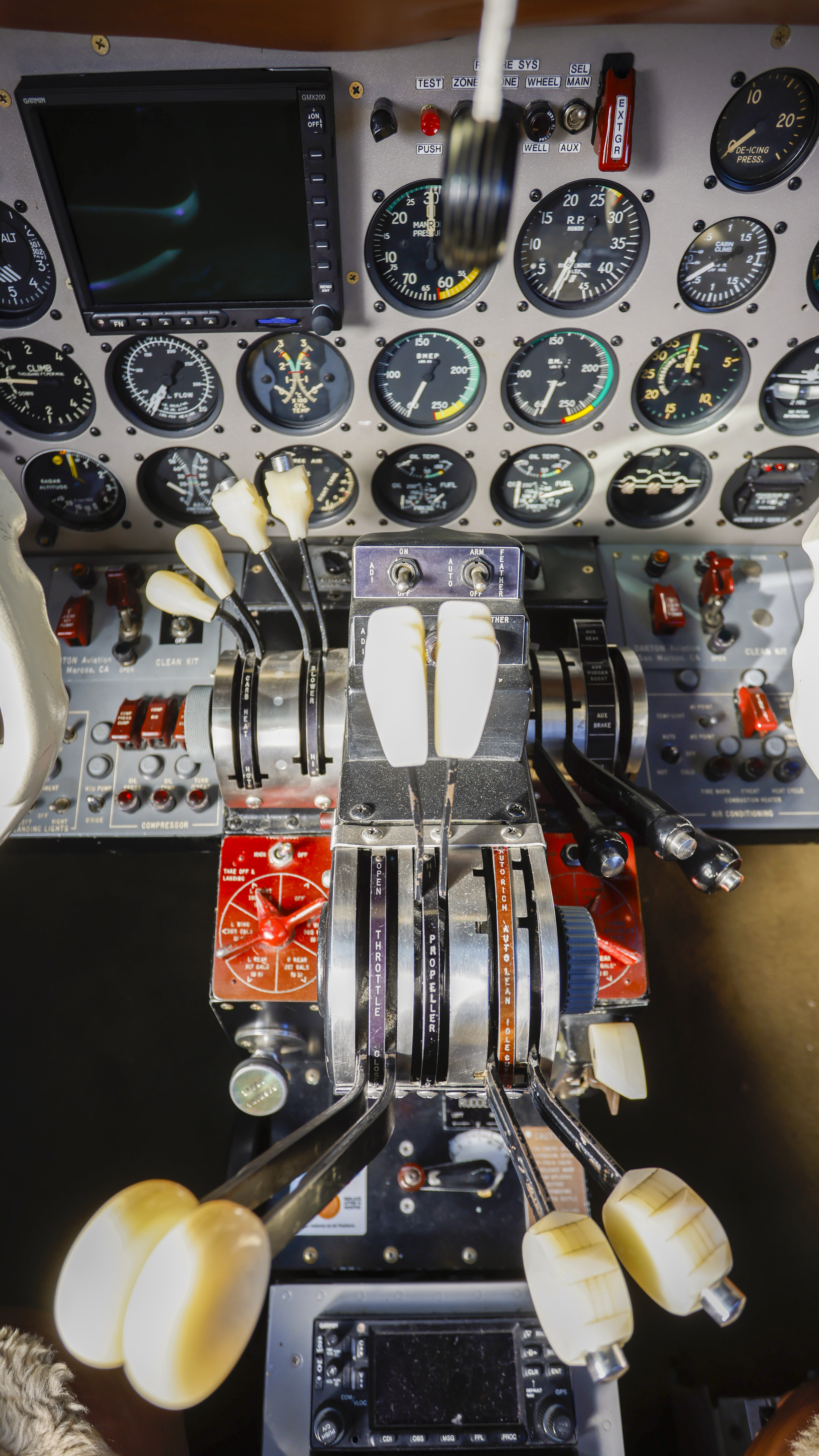 Engine controls are mounted between the two pilots.