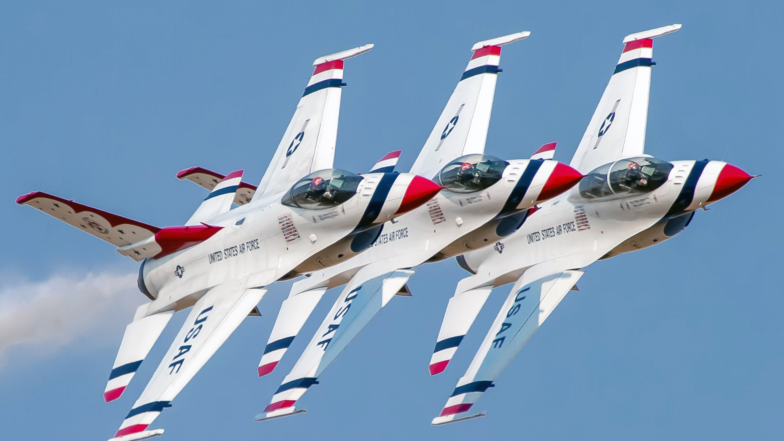 In the 1950s the team used F–84F Thunderstreaks modified with smoke tanks and red, white, and blue drag chutes. Since 1953, the Thunderbirds team has served as the premier U.S. Air Force air demonstration squadron, flying in incredibly tight formation. U.S. Air Force Staff Sgt. Cory Bush 