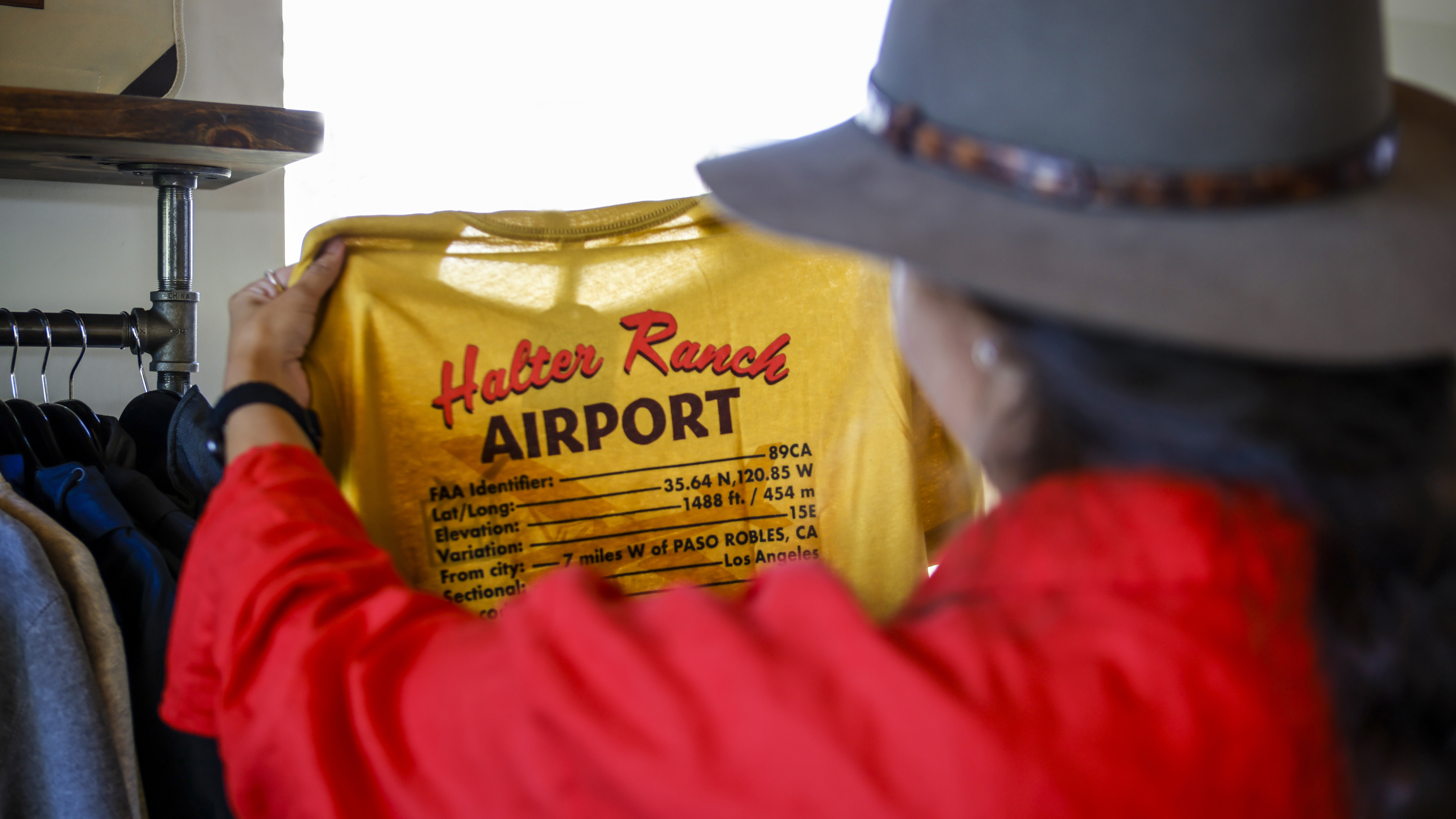 The shop at Halter Ranch not only sells wine, it also sells shirts with the airport’s specs.