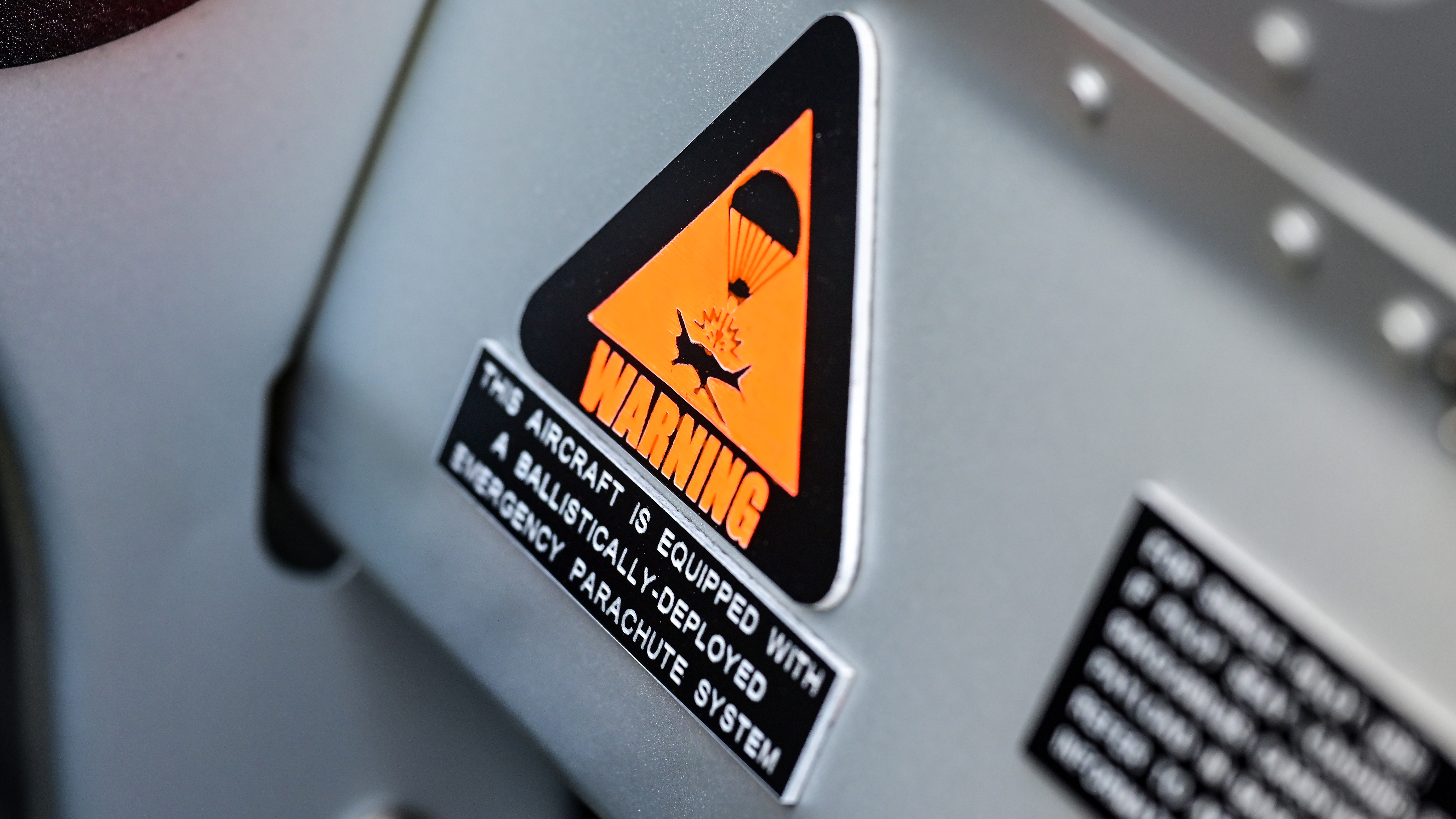 Galaxy ballistic parachute blow-out panel placard.