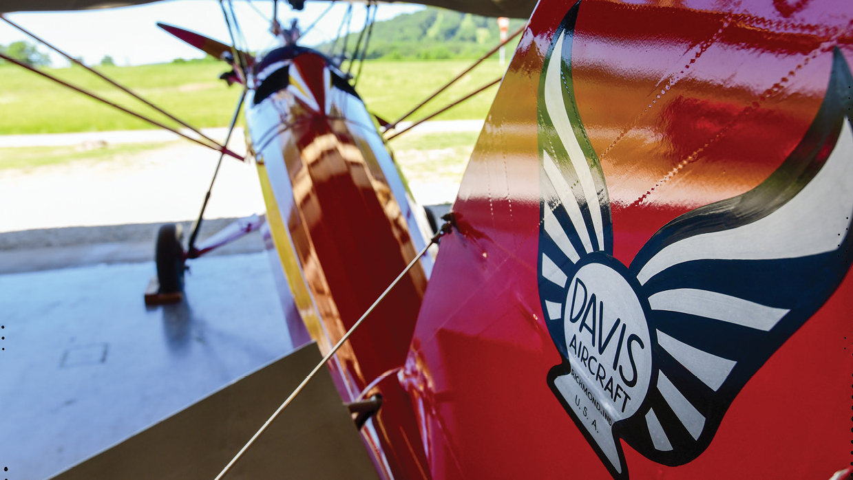 Kinner Motors was the first owner of N158Y and likely displayed its corporate logo somewhere on the airplane. Machamer chose to use the Davis logo. 