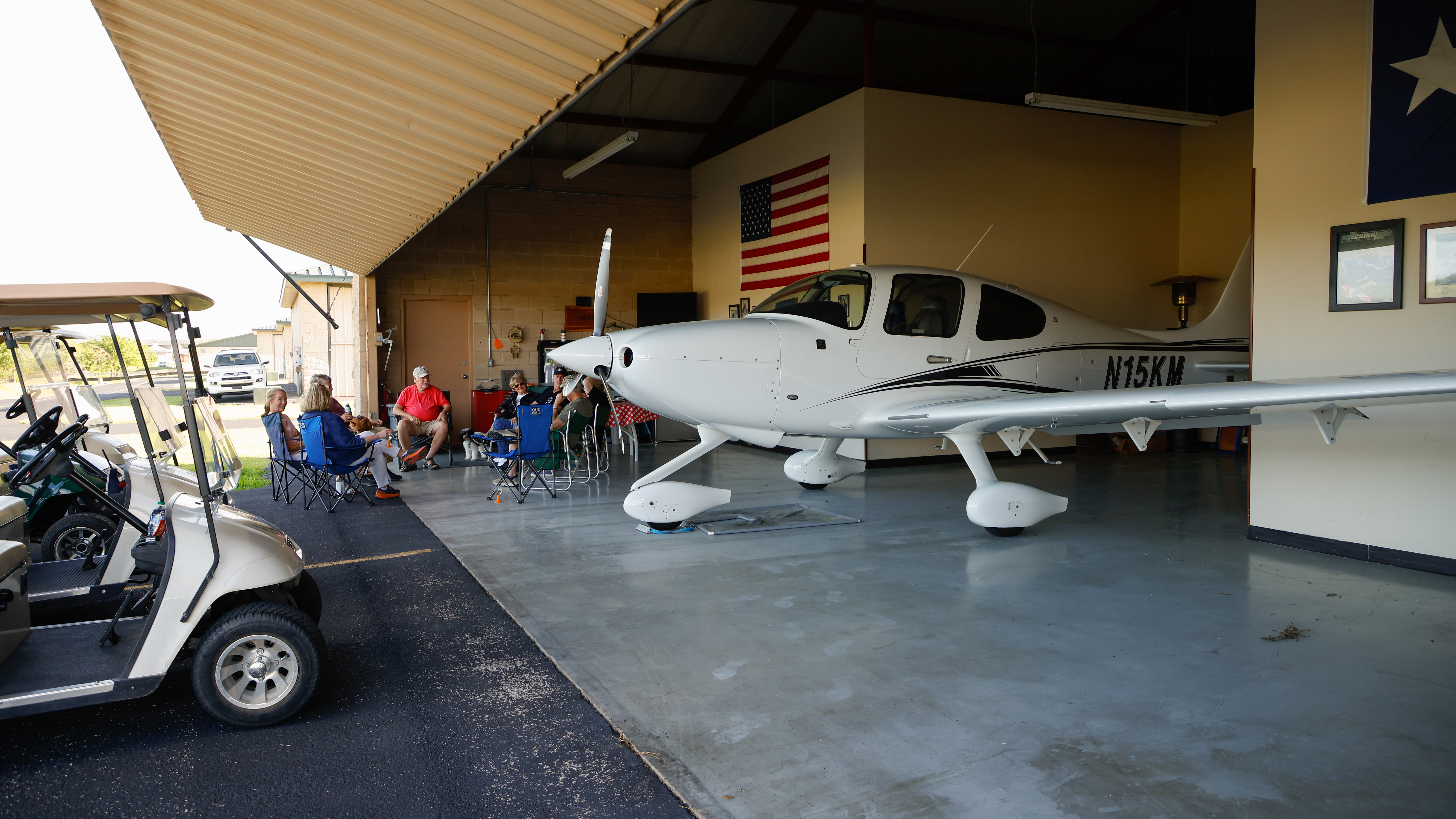 Mike Collier, Bill Kulpa, Joan Collier, Keith Durio, Sue Durio, Jean Thompson, and Phil Thompson are among the friends who regularly gather at one another’s hangars for cocktails and camaraderie most evenings at the airpark.