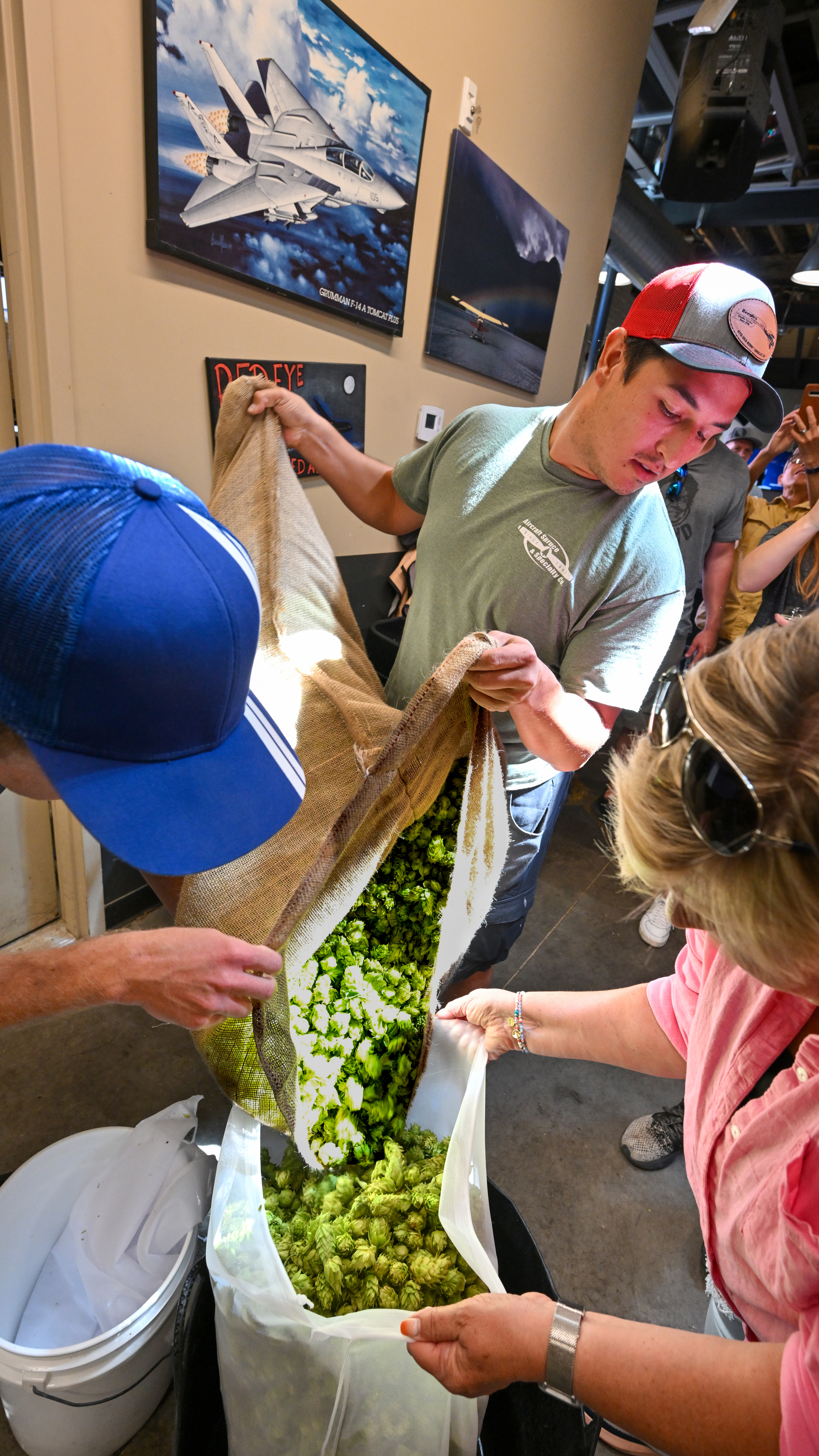 Volunteers and pilots learning how to brew