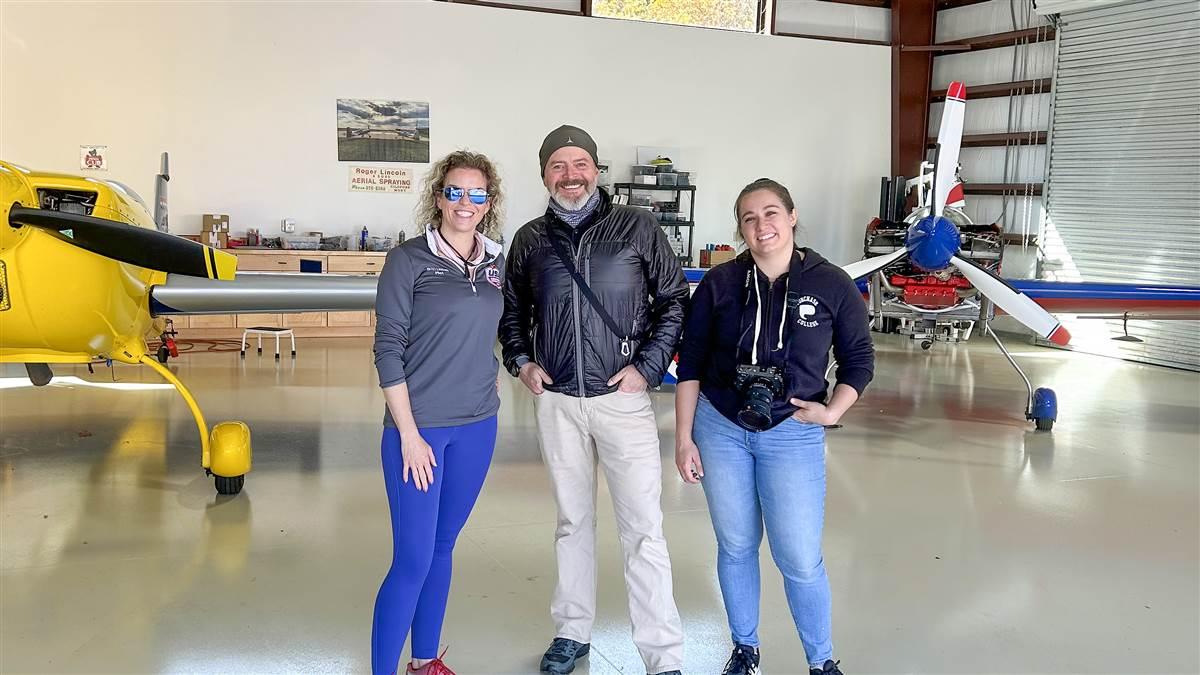 Photographer Chris Rose and Video Content Producer Michelle Walker meet with aerobatic champion pilot Britt Lincoln in her hangar at Big South Fork Airpark (SCX) in Tennessee.; @sumwalk736