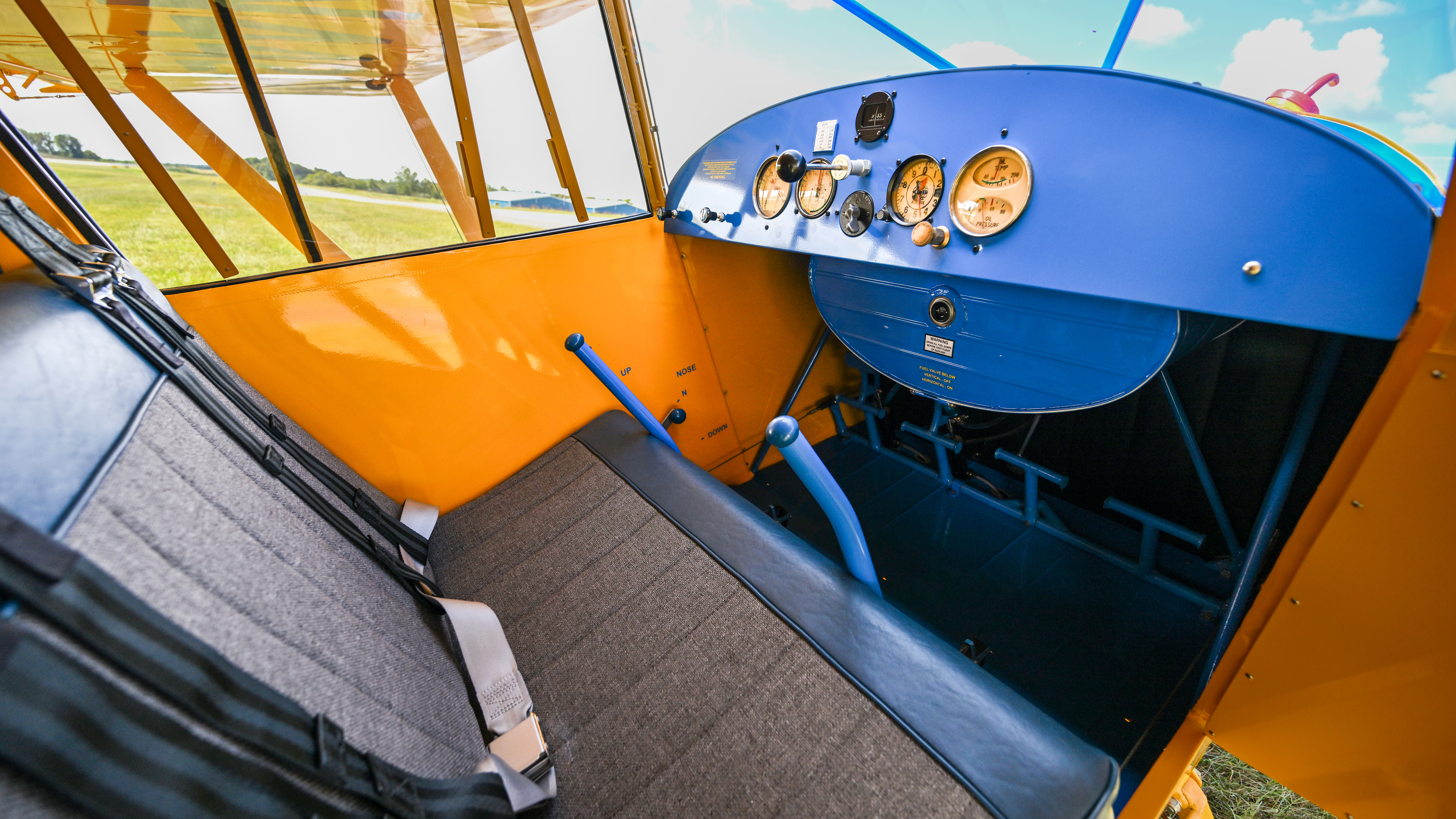 The bench seating in the Vagabond was one of the reasons for the Piper design's success; Piper's had traditionally had tandem seating. The Hausers did put in individual seat belts, not the big lap belt on the original.