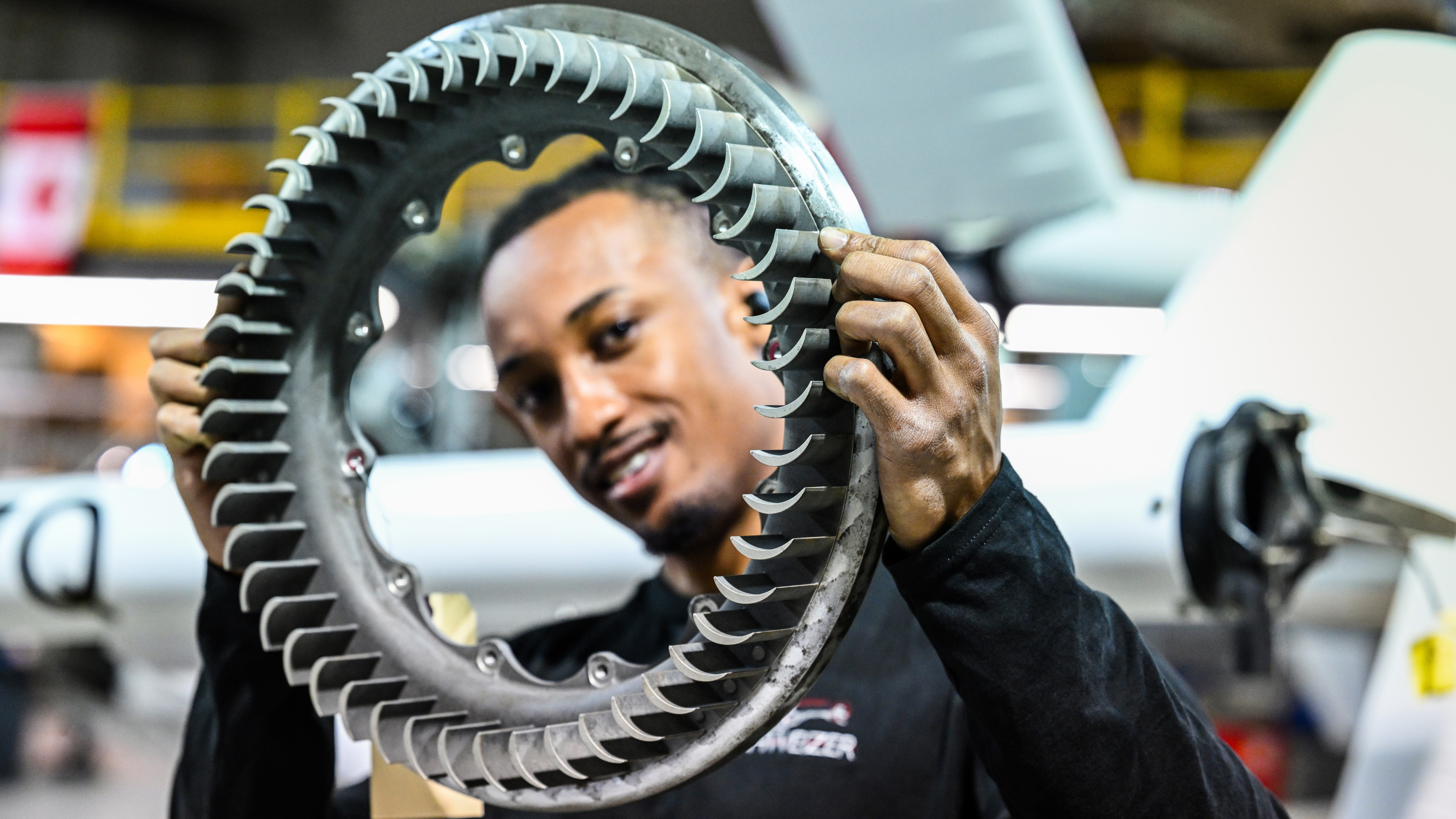 Maintenance technician Malik Williams prepares to install an impeller assembly.