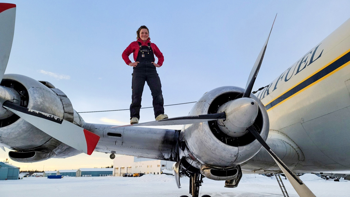 Mikaela Young stands atop a DC–6 during her time at Everts Air Cargo. Photography courtesy of Mikaela Young