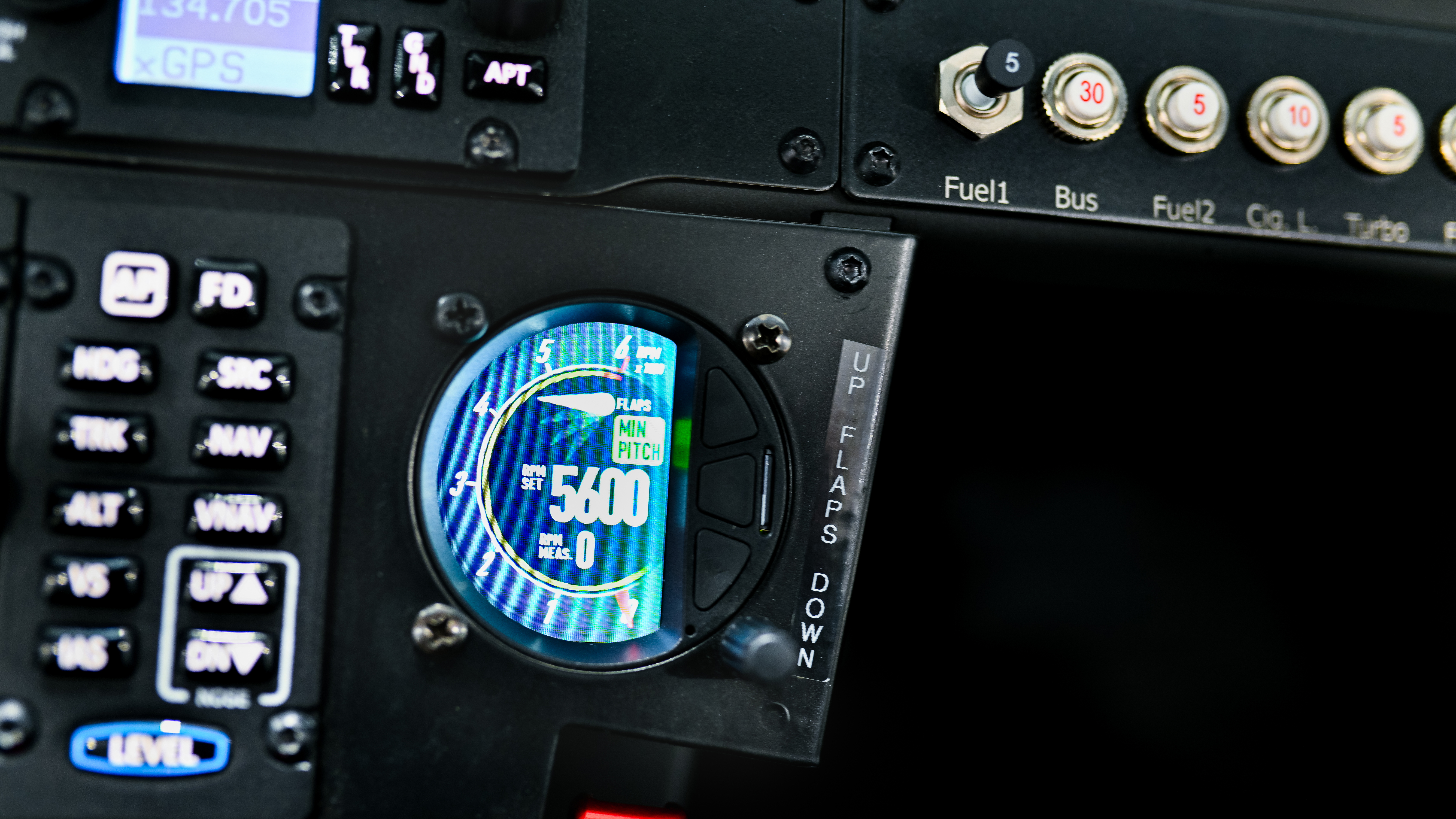 A digital display on the flap control shows flap position and rpm.