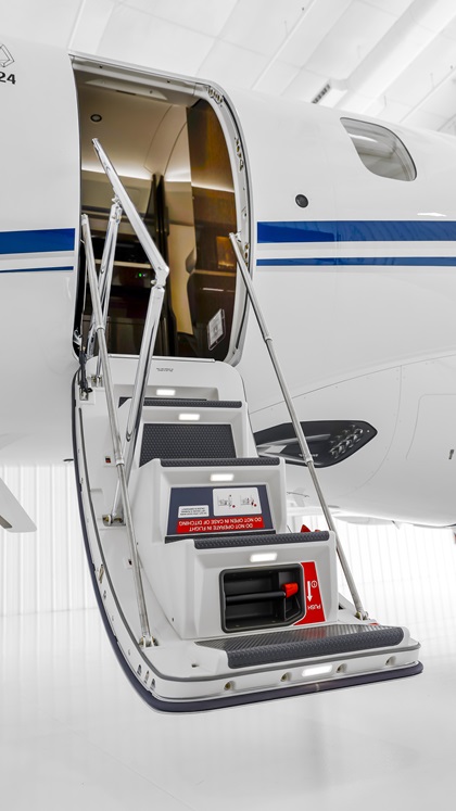 A one-piece, air-stair door is so well balanced, it's easy for one crew member to open and close. Photography by Chris Rose