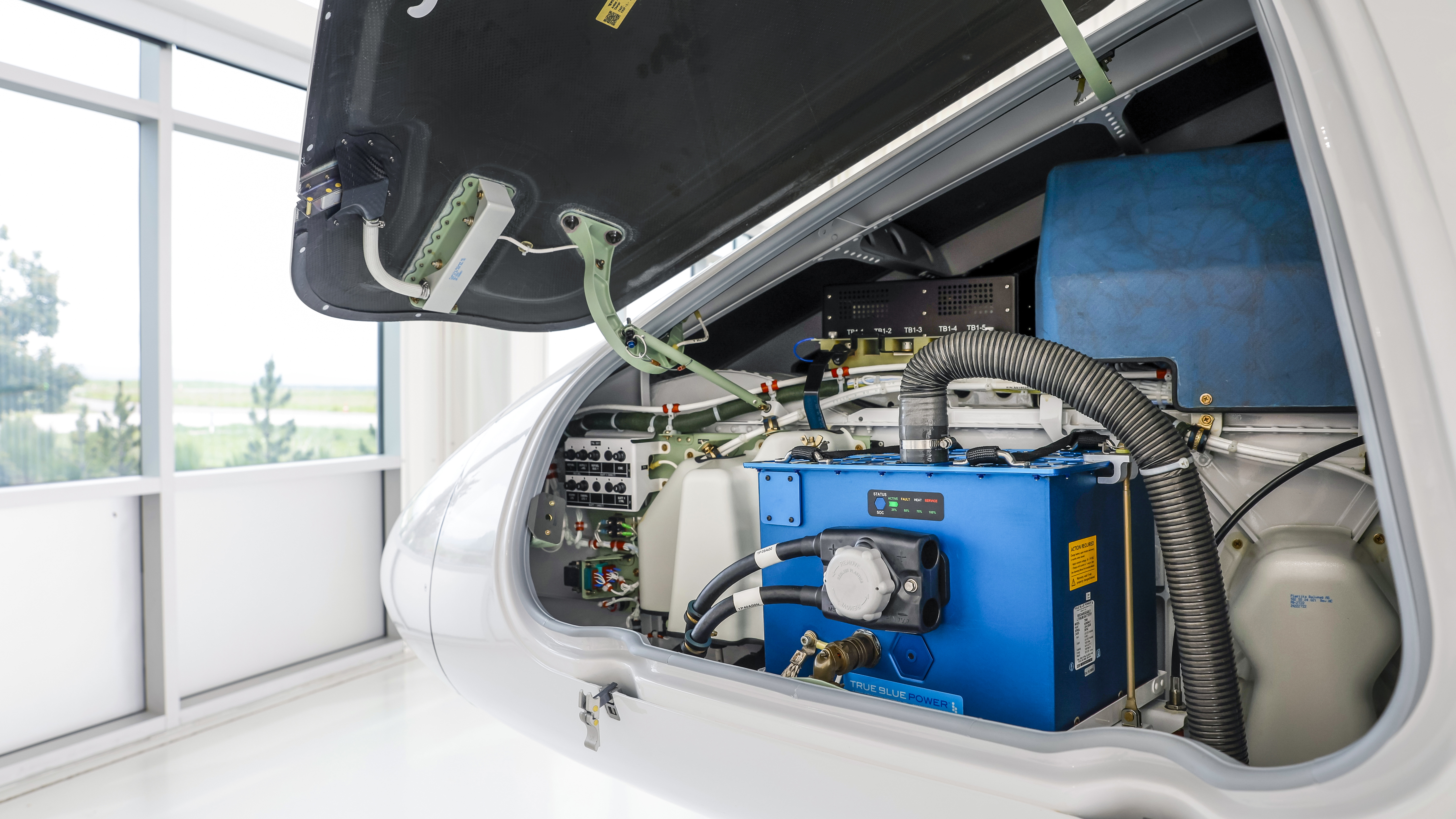 The PC–24 nose compartment contains one of the airplane's two lightweight batteries—not baggage.